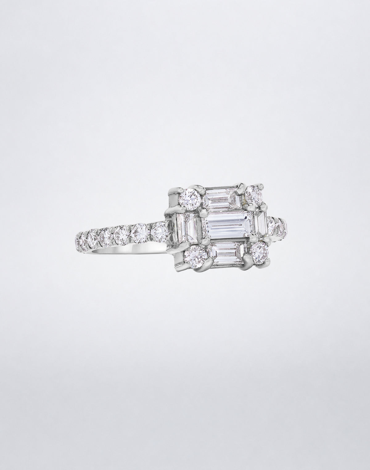 CLARITY³ Cube Diamond Band in 18K white gold featuring a baguette-cut diamond cluster with round diamonds along the band, by Mindi Mond New York, side view