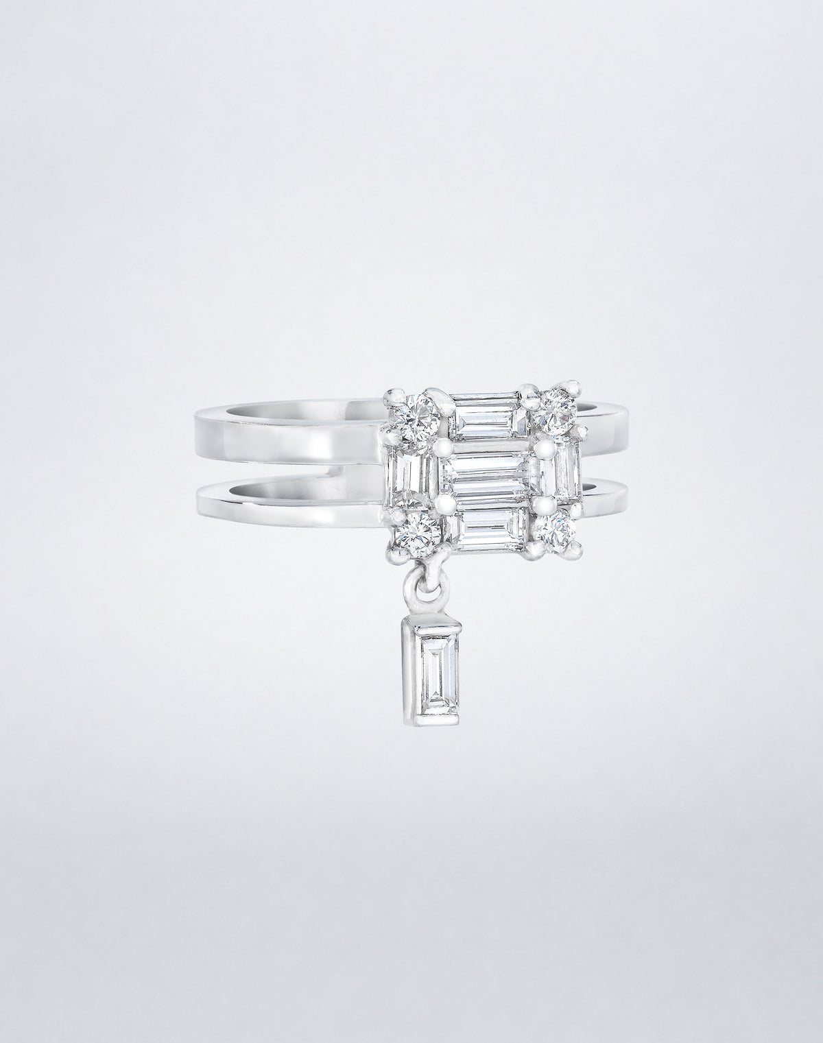 CLARITY³ Dangling Double Shank Ring in 18K white gold, featuring a square cluster of baguette and round diamonds with a dangling baguette diamond below, shown at an angle, by Mindi Mond New York
