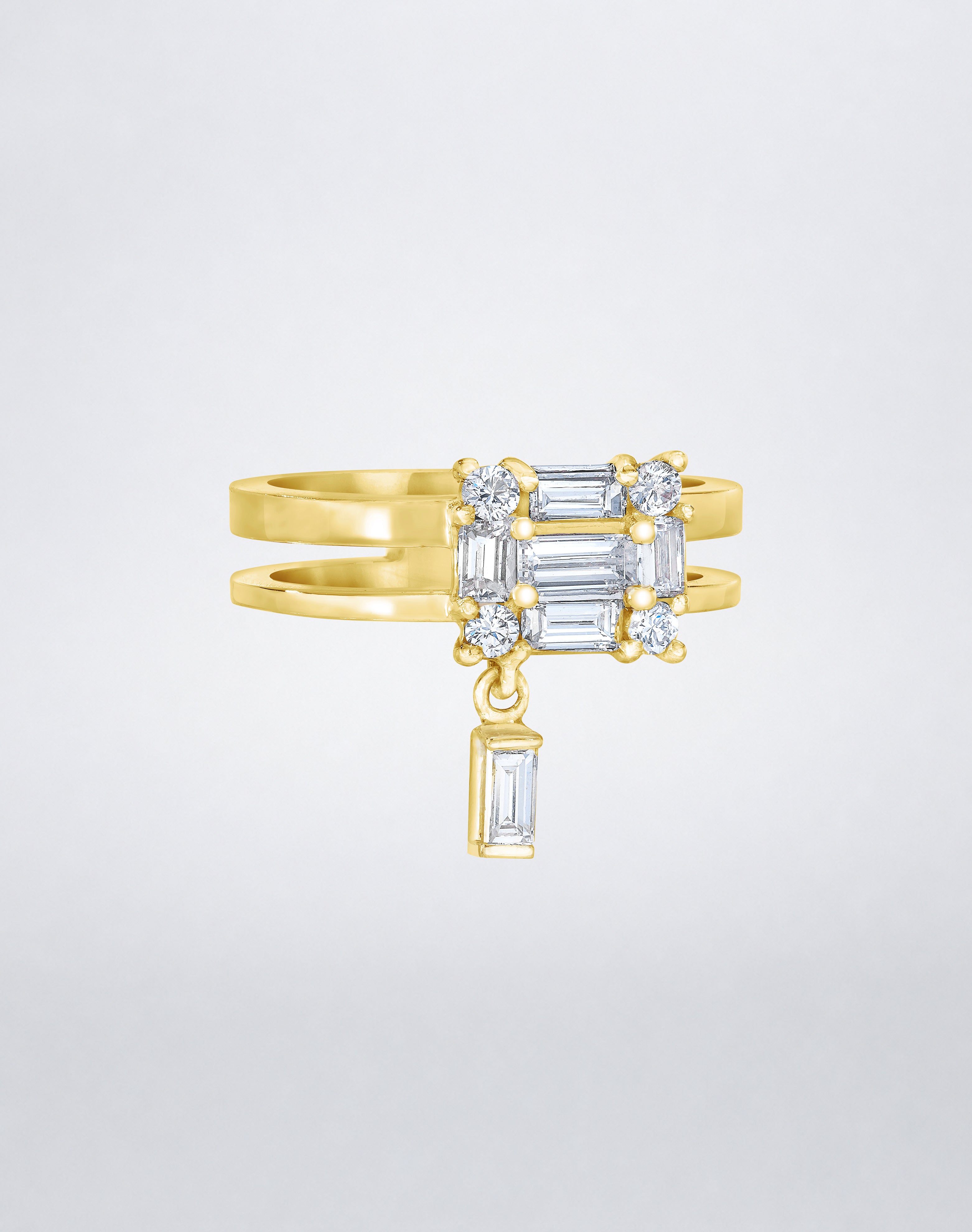 CLARITY³ Dangling Double Shank Ring in 18K yellow gold, featuring a square cluster of baguette and round diamonds with a dangling baguette diamond below, by Mindi Mond New York, side view.