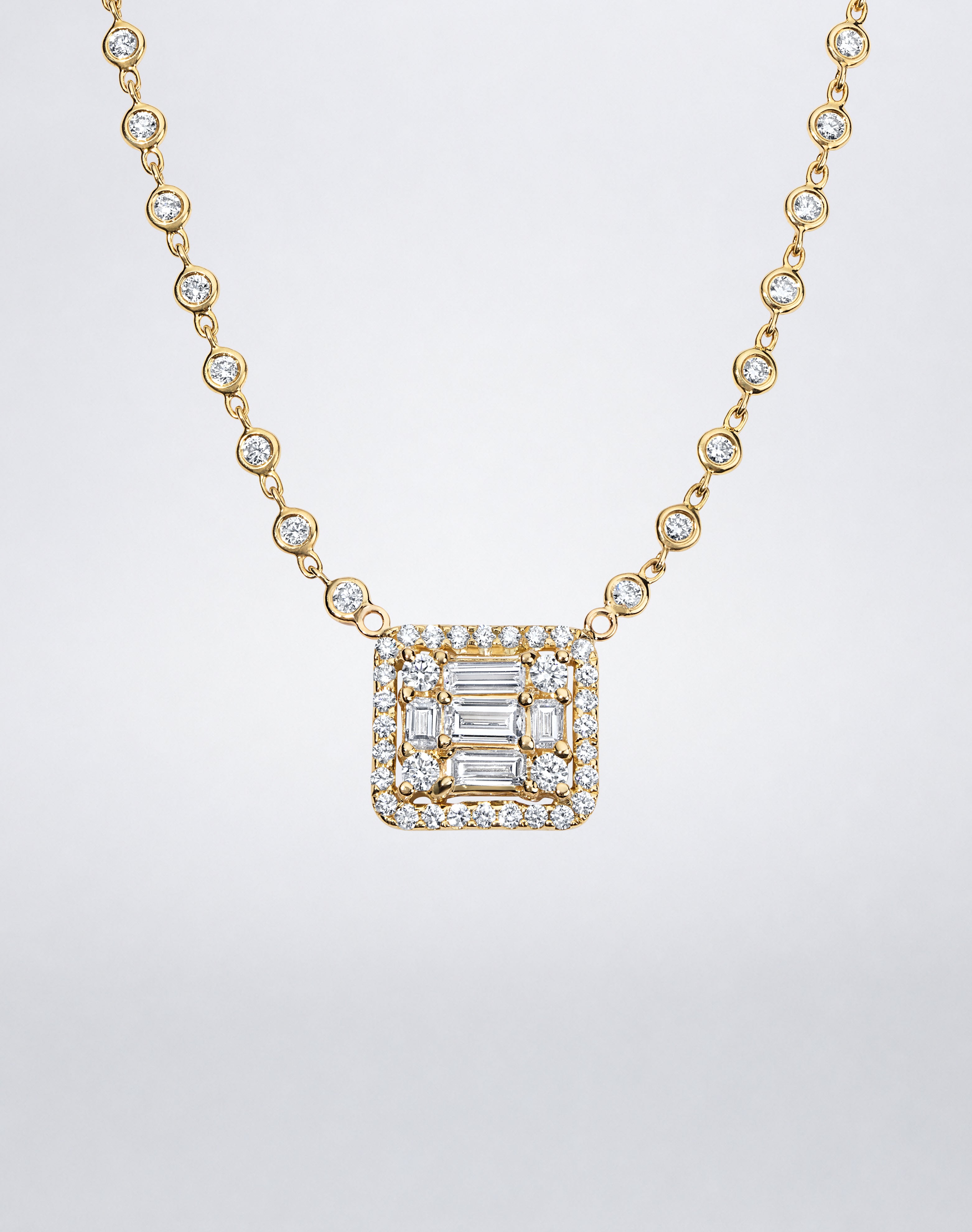 Mindi Mond New York Clarity³ All Diamond Halo Cube Necklace in 18K yellow gold, close-up of the nine-stone diamond cube with pavé halo and bezel-set diamond chain