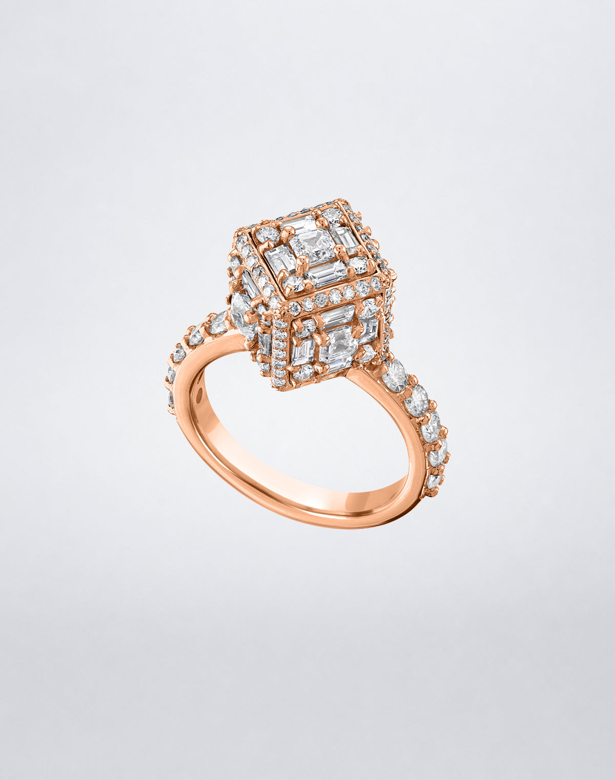 CLARITY³ Dimensional Halo Diamond Ring in 18K rose gold, featuring a sculptural diamond cube on a pavé diamond shank, shown at an angle, by Mindi Mond New York