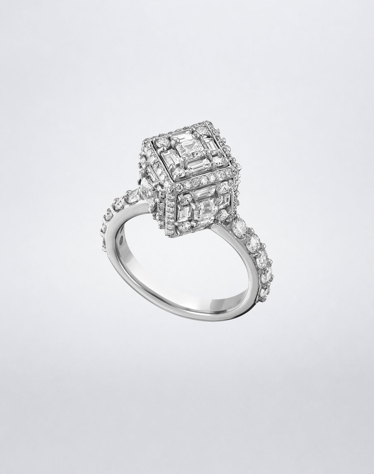 CLARITY³ Dimensional Halo Diamond Ring in 18K white gold, featuring a sculptural diamond cube on a pavé diamond shank, shown at an angle, by Mindi Mond New York