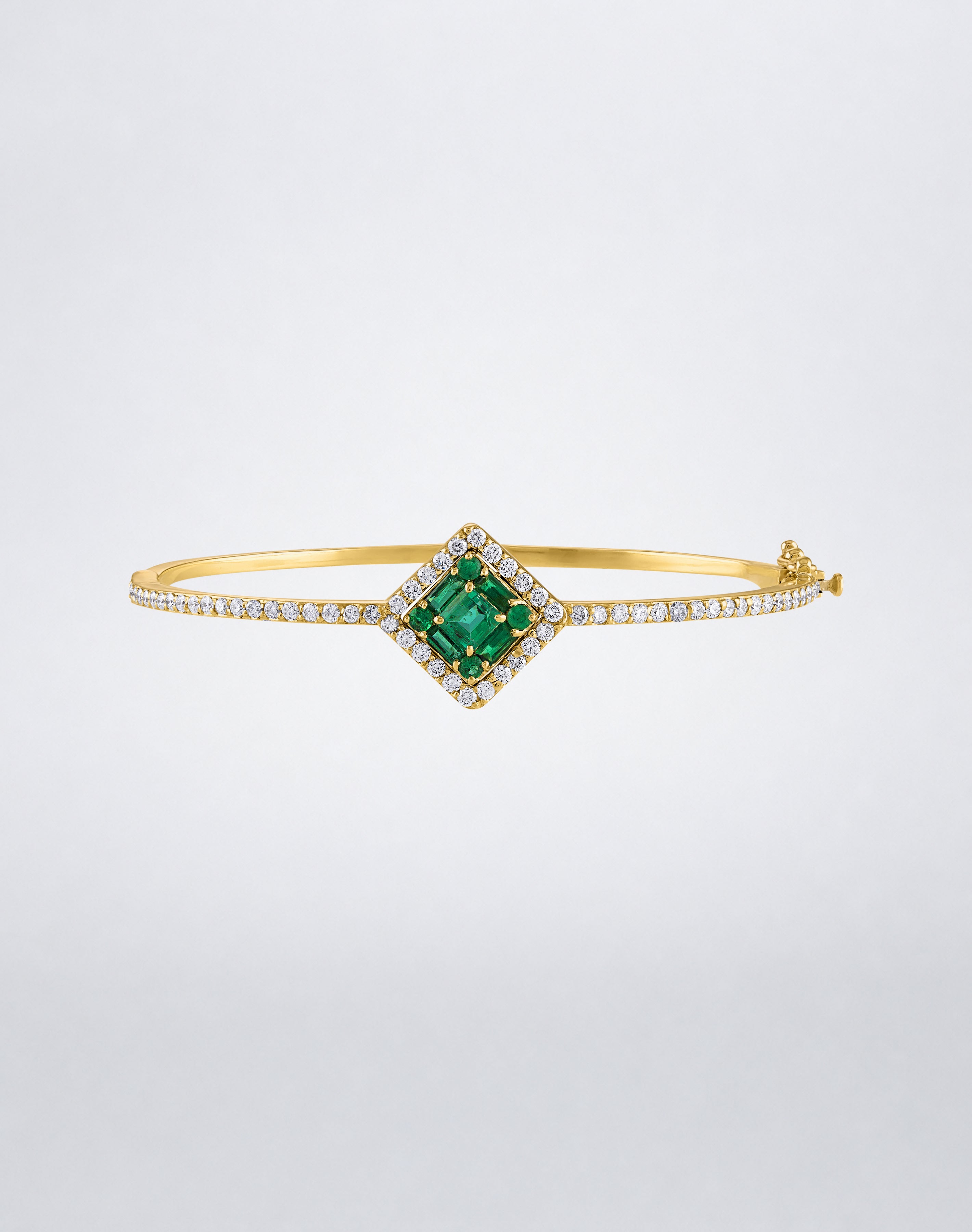 Mindi Mond New York Clarity³ Gemstone Halo Bracelet in 18k yellow gold with a nine-stone baguette and round emerald center, diamond halo and pavé band, front view