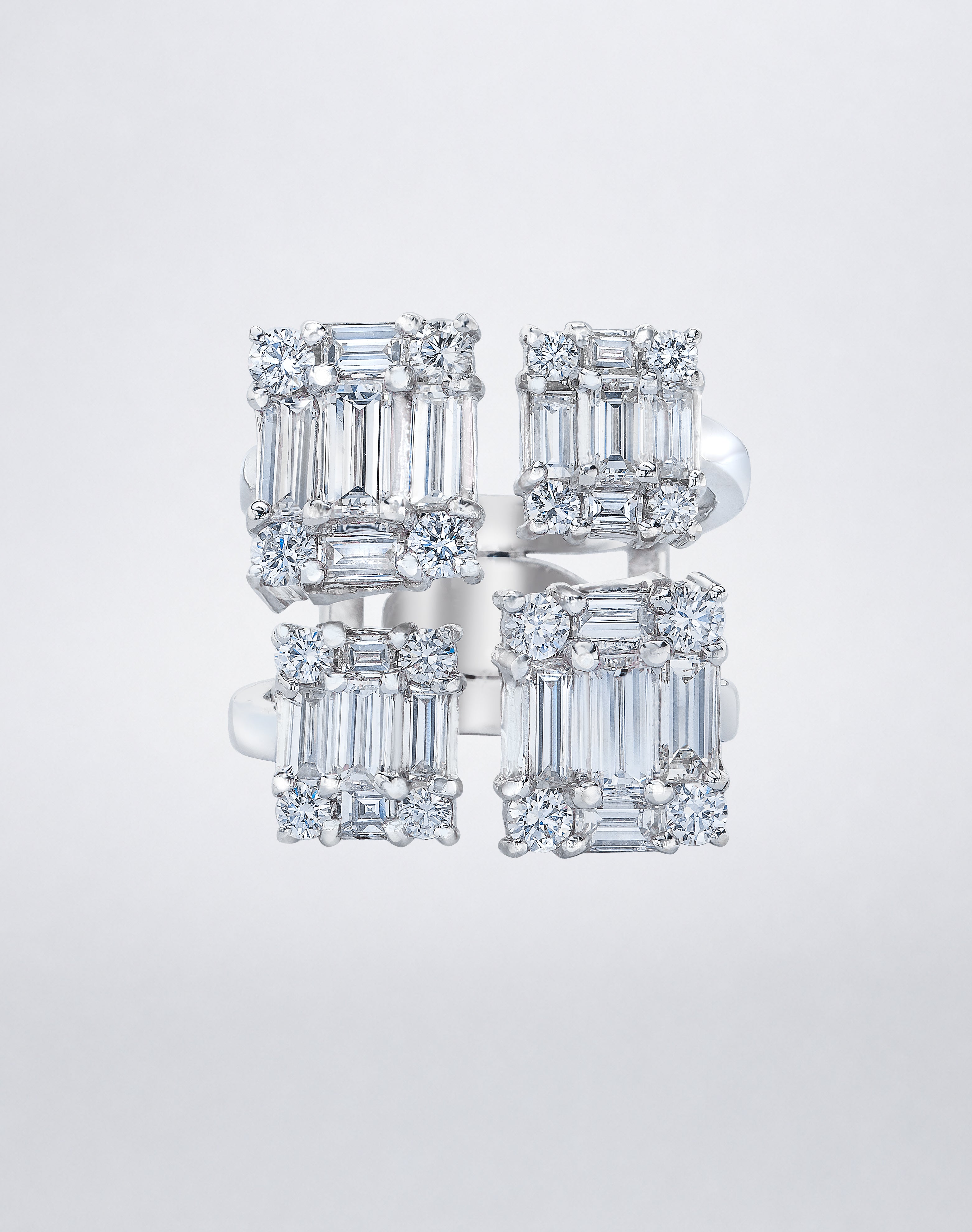 CLARITY³ Quad Ring in 18K white gold featuring four rectangular clusters of baguette-cut and round diamonds, front view