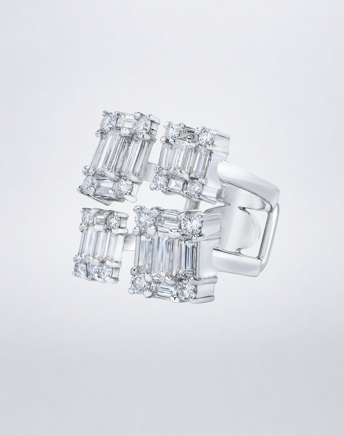 CLARITY³ Quad Ring in 18K white gold featuring four rectangular clusters of baguette-cut and round diamonds, side view