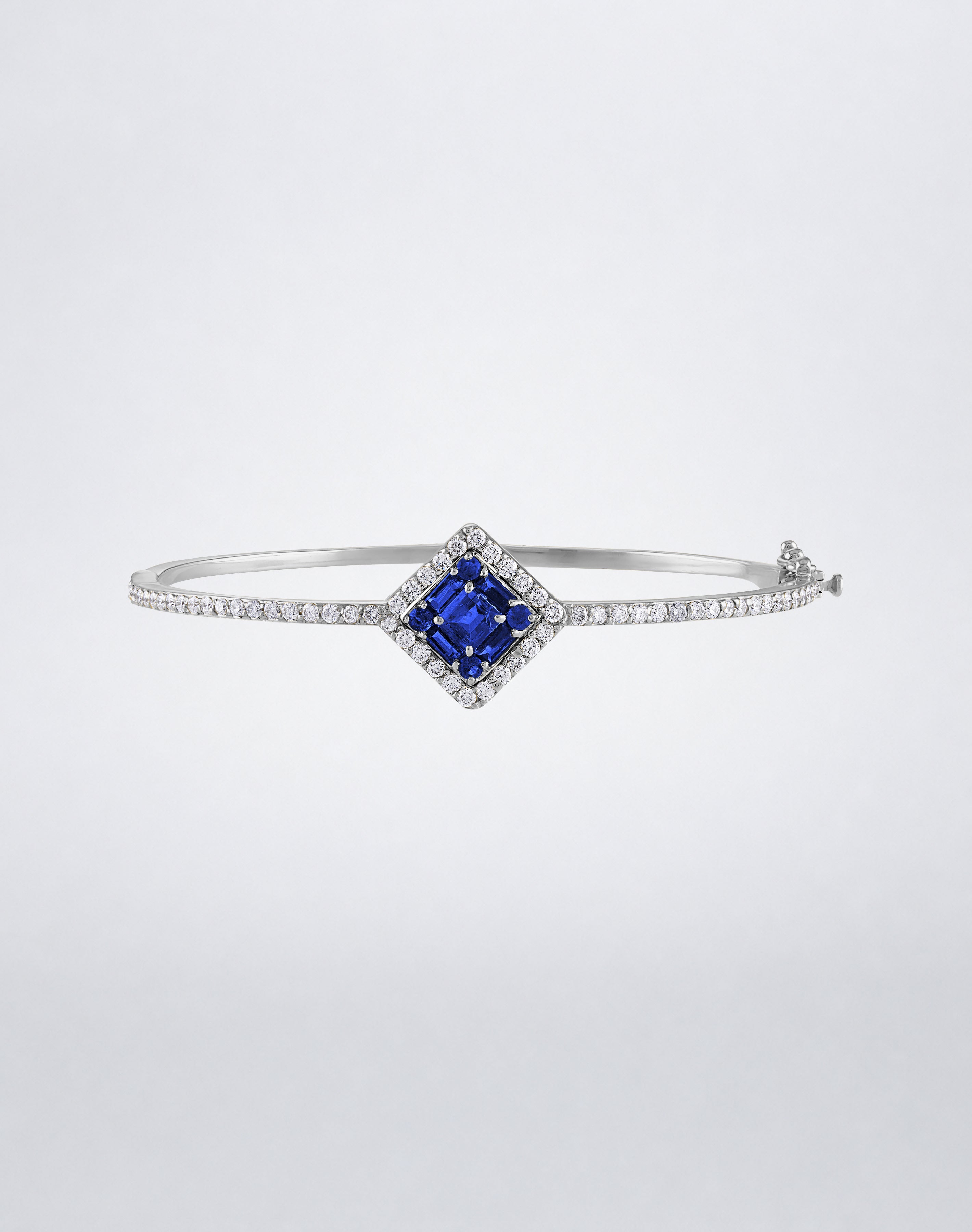 Mindi Mond New York Clarity³ Gemstone Halo Bracelet in 18k white gold with a nine-stone baguette and round sapphire center, diamond halo and pavé band, front view