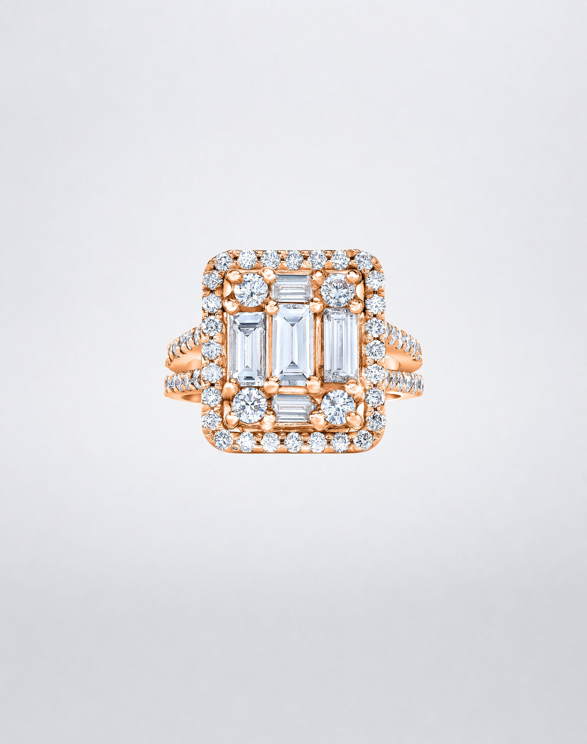 CLARITY³ Split-Shank Halo Ring in 18K rose gold with a baguette diamond cluster and round diamond halo, by Mindi Mond New York