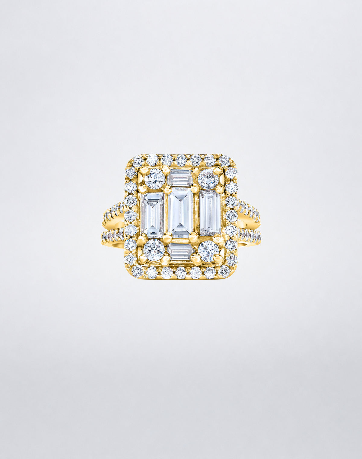 CLARITY³ Split-Shank Halo Ring in 18K yellow gold with a baguette diamond cluster and round diamond halo, by Mindi Mond New York
