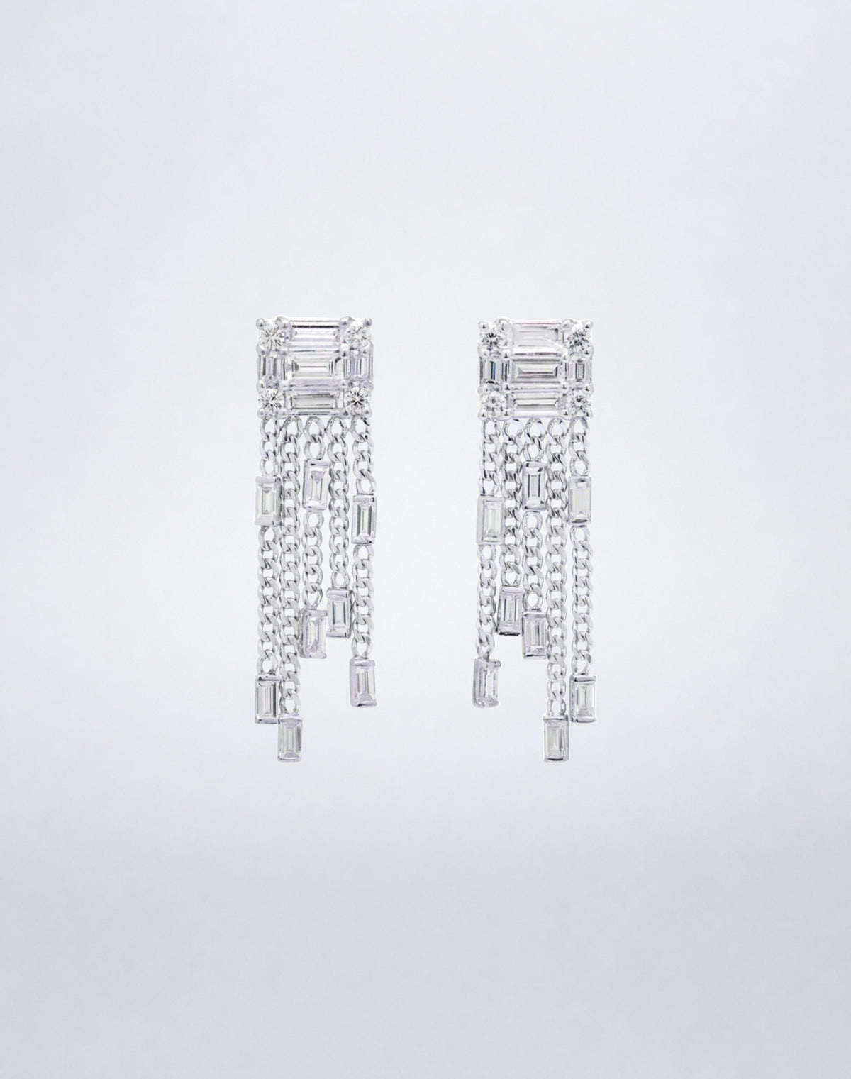 Mindi Mond New York Clarity³ Tassel Earrings in 18K white gold, a diamond formation trailing five chains tipped with baguette diamonds