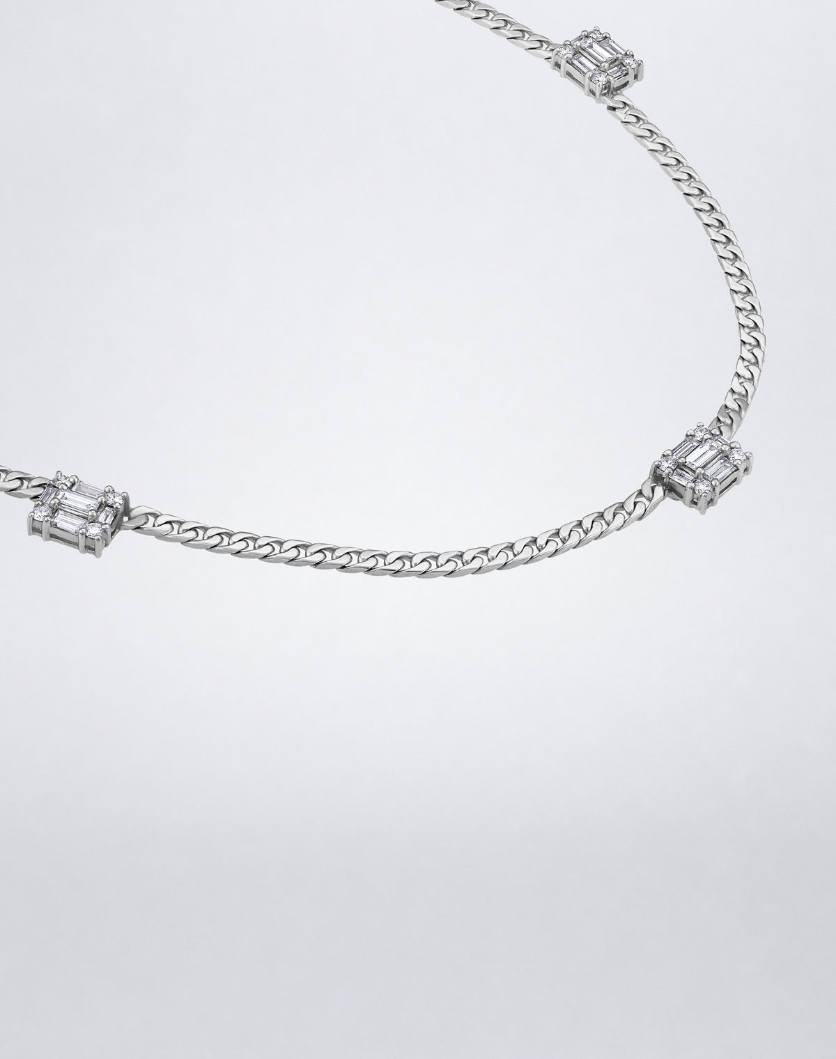 Mindi Mond New York Clarity³ Triple Link Necklace in 18K white gold, close angle on the curb-link chain and three nine-stone diamond cubes