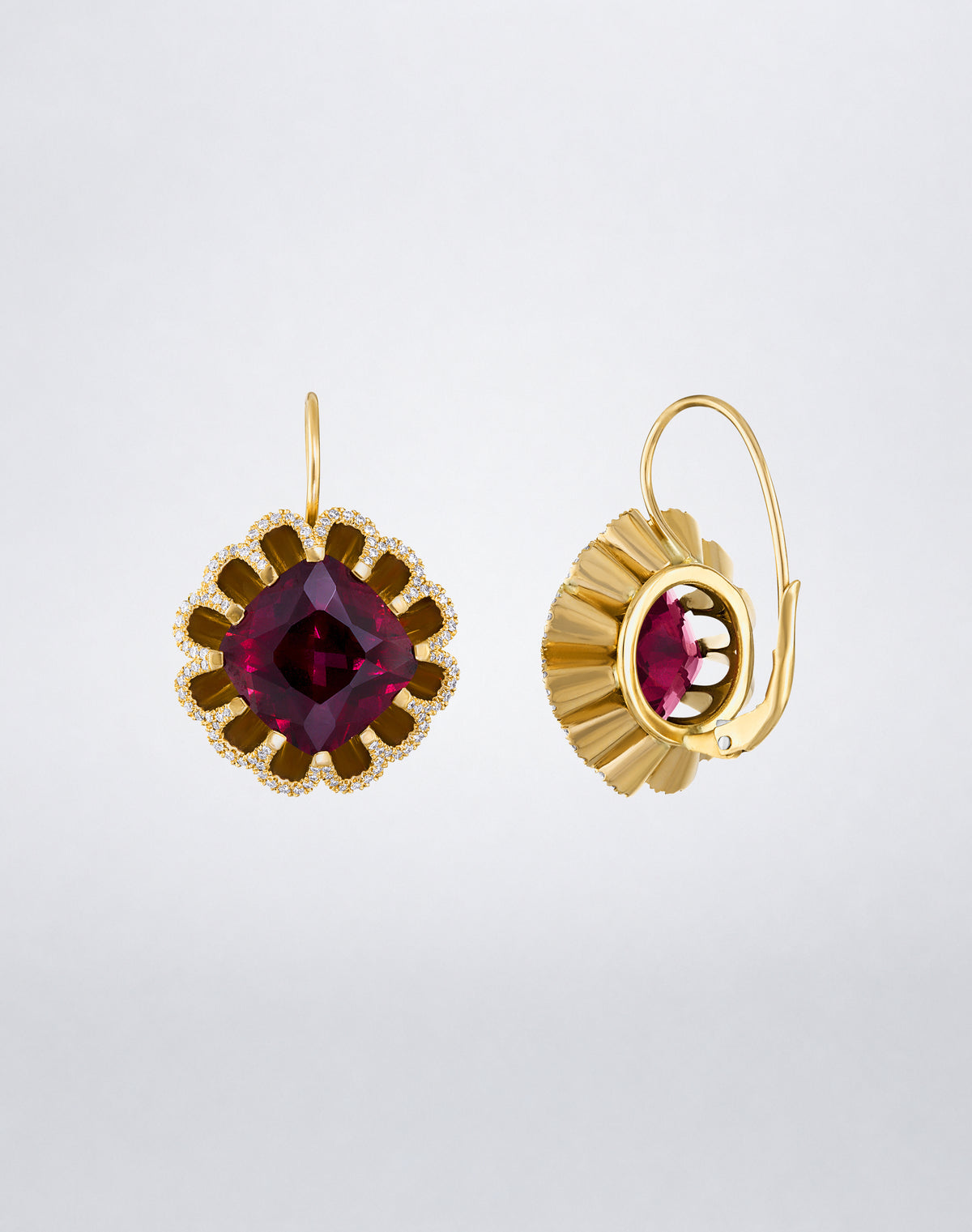Side detail of Mindi Mond New York Floating Hues Rhodolite Garnet and Diamond Drop Earrings with cushion-cut garnets and leverback closures in 18K yellow gold