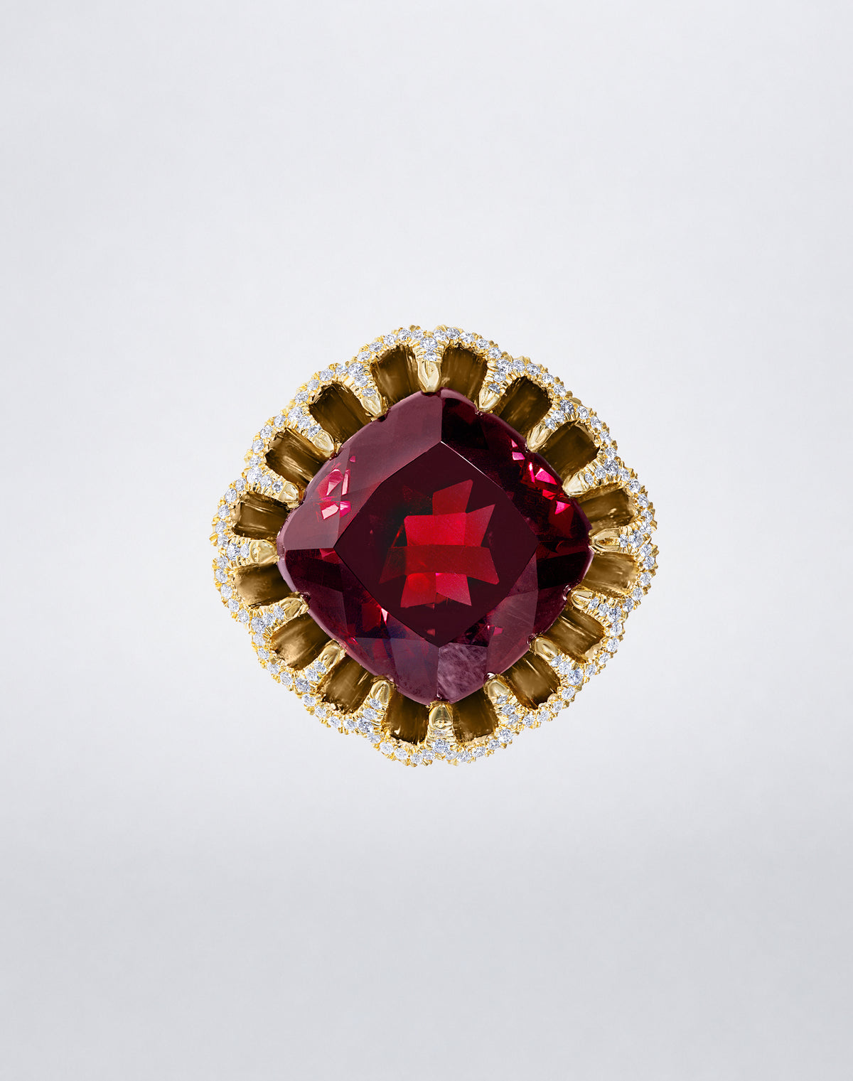 Mindi Mond New York FLOATING HUES Rhodolite Garnet and Diamond Ring in 18K yellow gold, front view showcasing a cushion-cut rhodolite garnet framed by diamonds in the iconic elliptical setting.