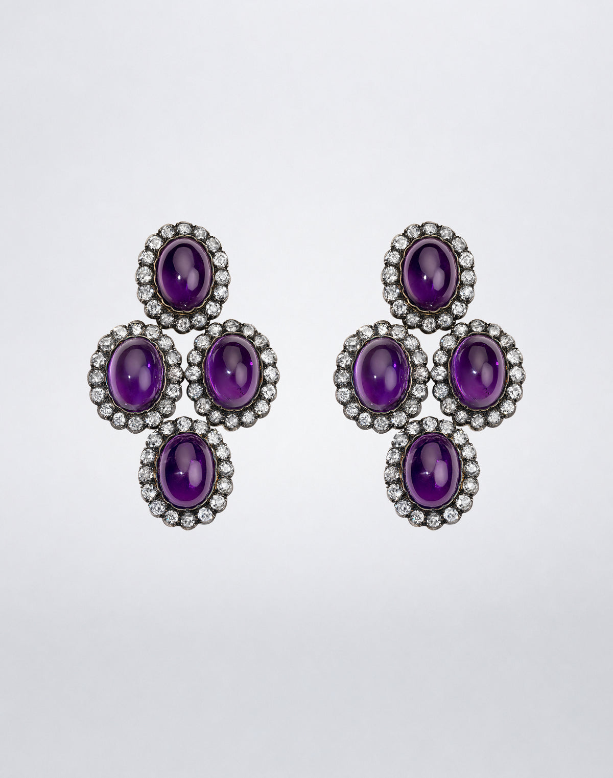 One-of-a-kind Mindi Mond New York Amethyst and Old Mine Diamond Girandole Earrings with four oval amethyst cabochons framed by diamonds.
