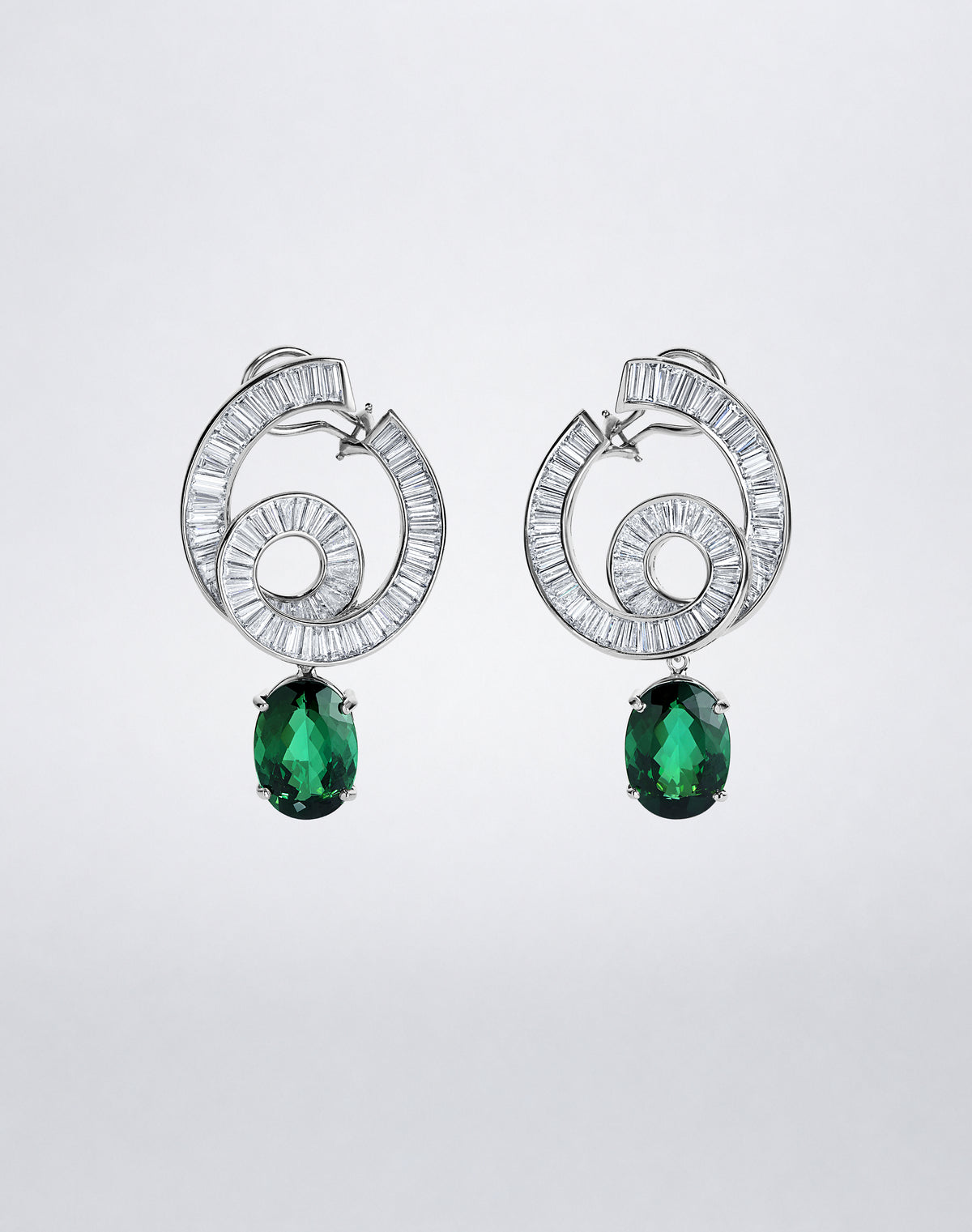 One-of-a-kind Celestial Diamond and Green Tourmaline Earrings with spiraling baguette diamonds and detachable oval green tourmaline drops.