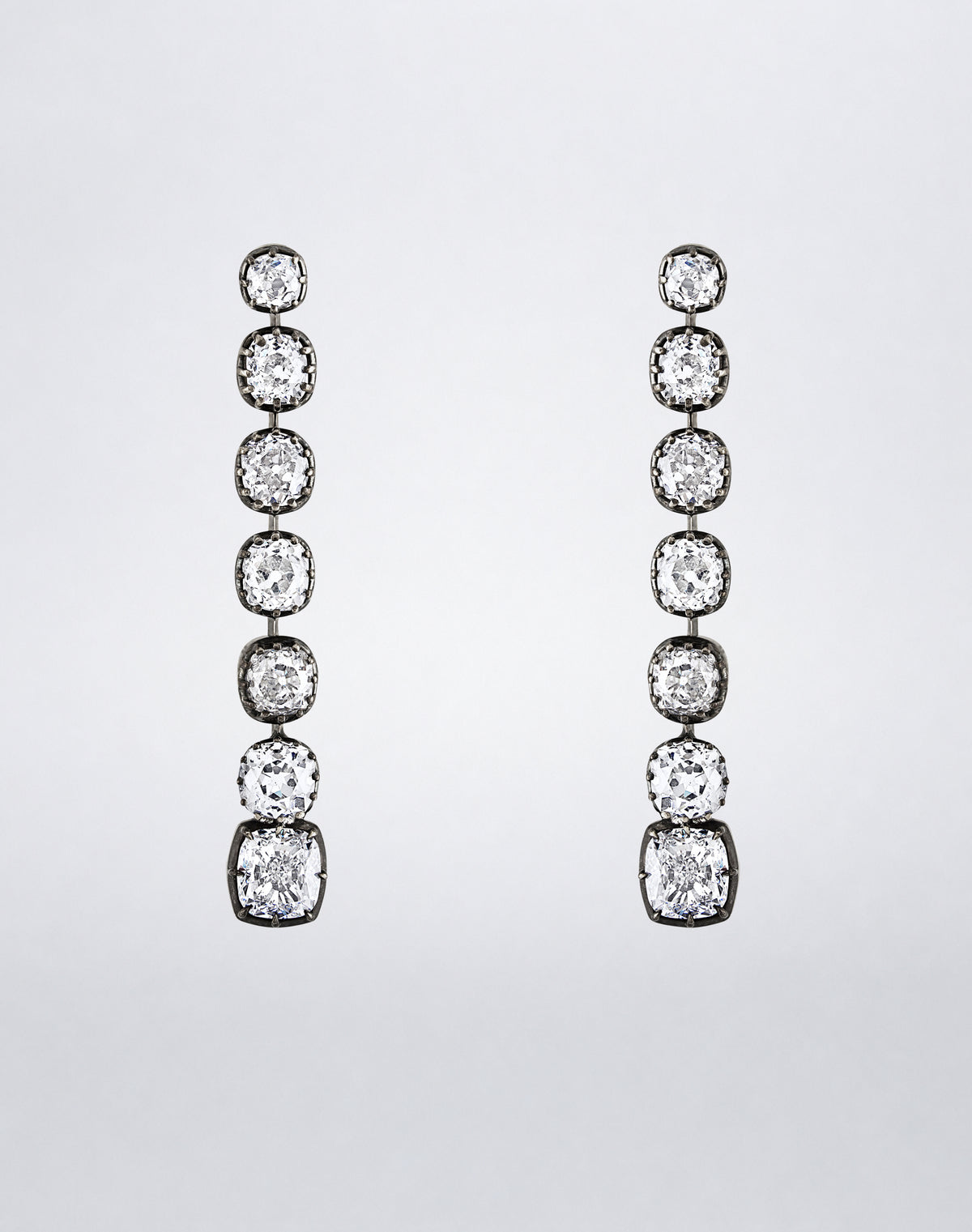 One-of-a-kind Cushion-Cut Diamond Line Earrings featuring seven graduated cushion-cut diamonds in a long linear drop.