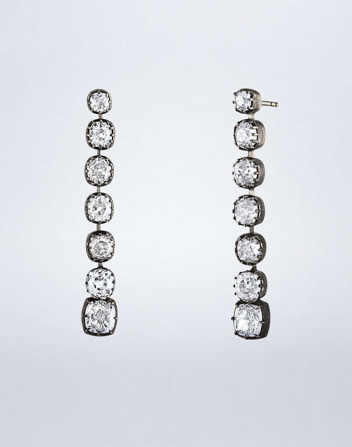 Front and side view of the one-of-a-kind Cushion-Cut Diamond Line Earrings showing the graduated diamonds and articulated settings.