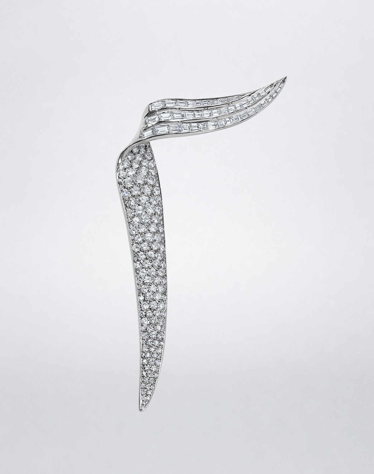 One-of-a-kind Mindi Mond New York RECONCEIVED Diamond Wing Brooch in white gold with round and baguette diamonds.