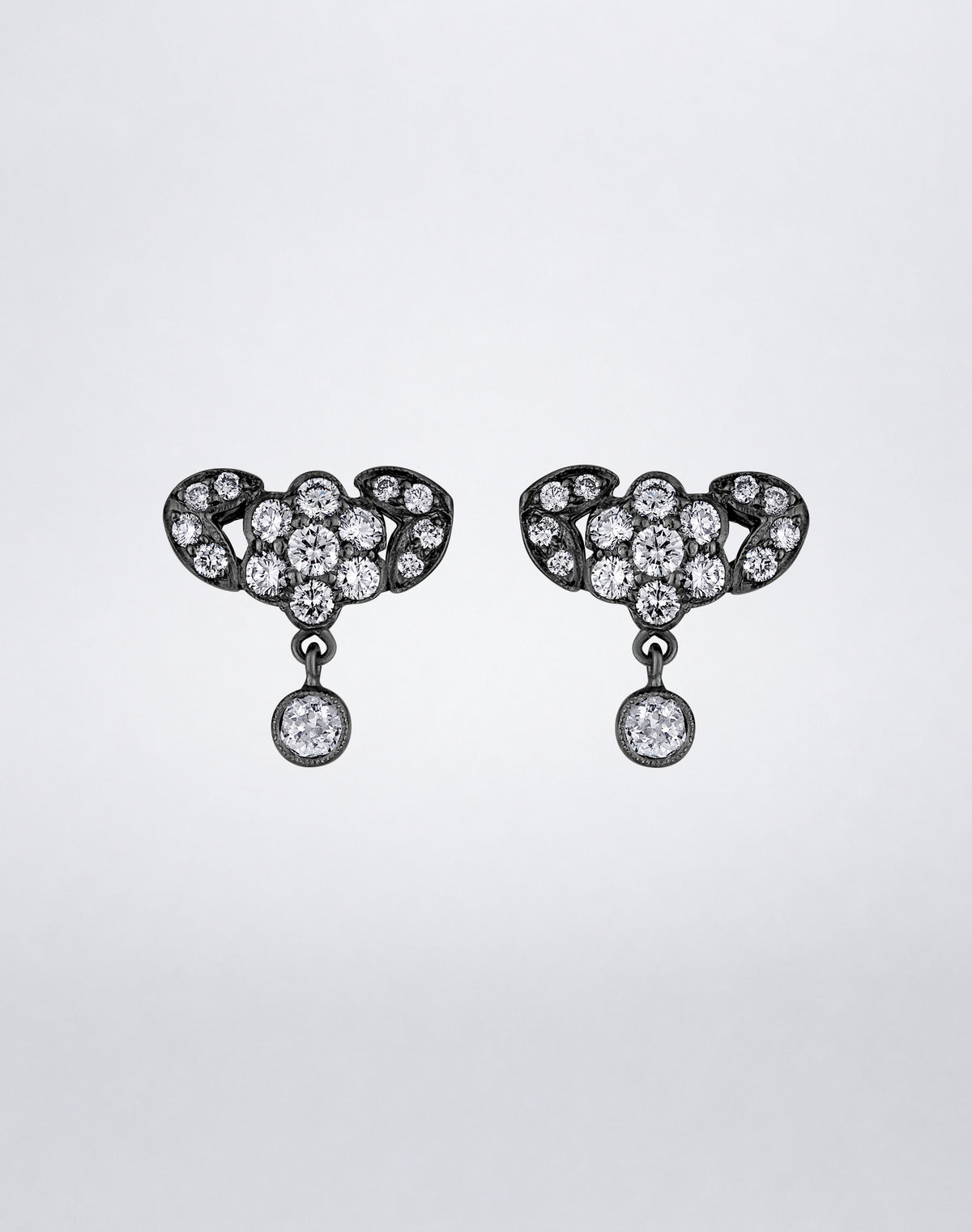 One-of-a-kind Floral Diamond Drop Earrings featuring clustered round diamonds in a floral motif with sculptural side details and suspended round diamond drops.