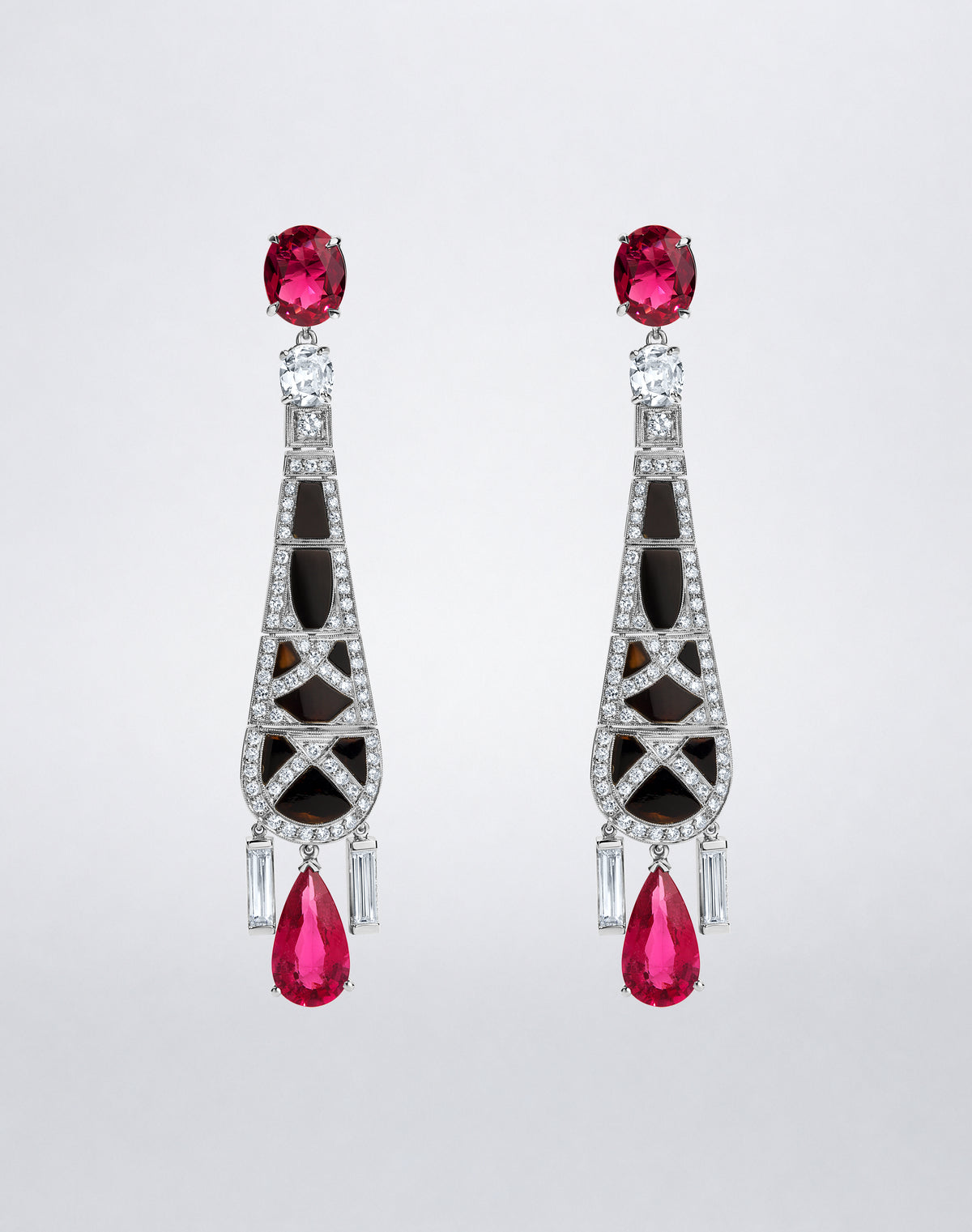 One-of-a-kind Geometric Onyx and Rubellite Earrings featuring vivid rubellites, sculptural black onyx panels and diamond accents in elongated drops.