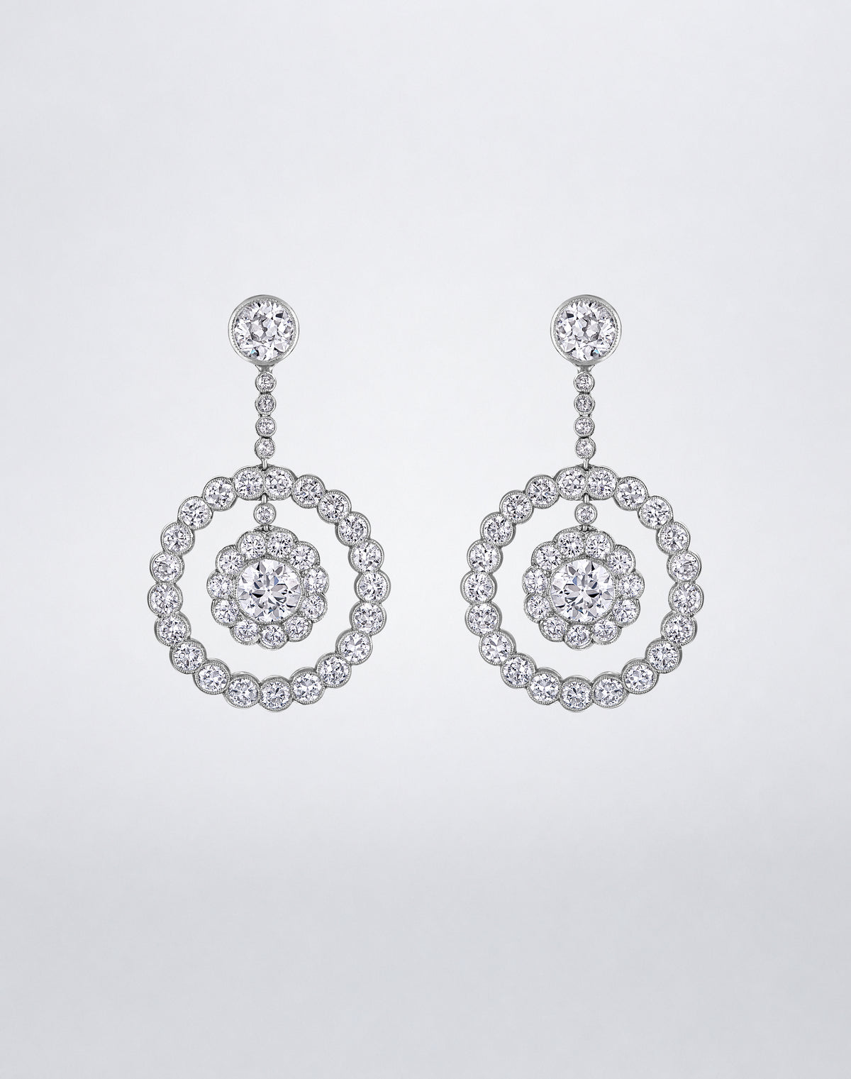 One-of-a-kind Old European Dangling Diamond Loop Earrings featuring round diamond studs, graduated diamond links and concentric circular diamond drops.