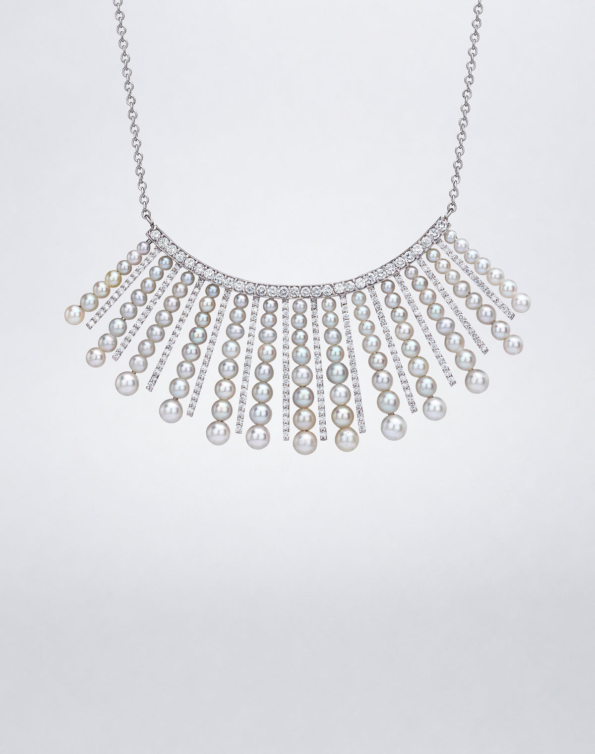 Detail of Mindi Mond New York Diamond and Pearl Spoke Necklace with graduated pearls and pavé diamond spokes in 18K white gold