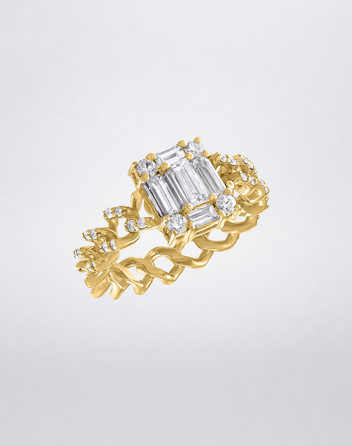 CLARITY³ All Diamond Link Ring in 18K yellow gold, featuring a diamond-set curb-link band and a baguette diamond cluster, shown at an angle, by Mindi Mond New York