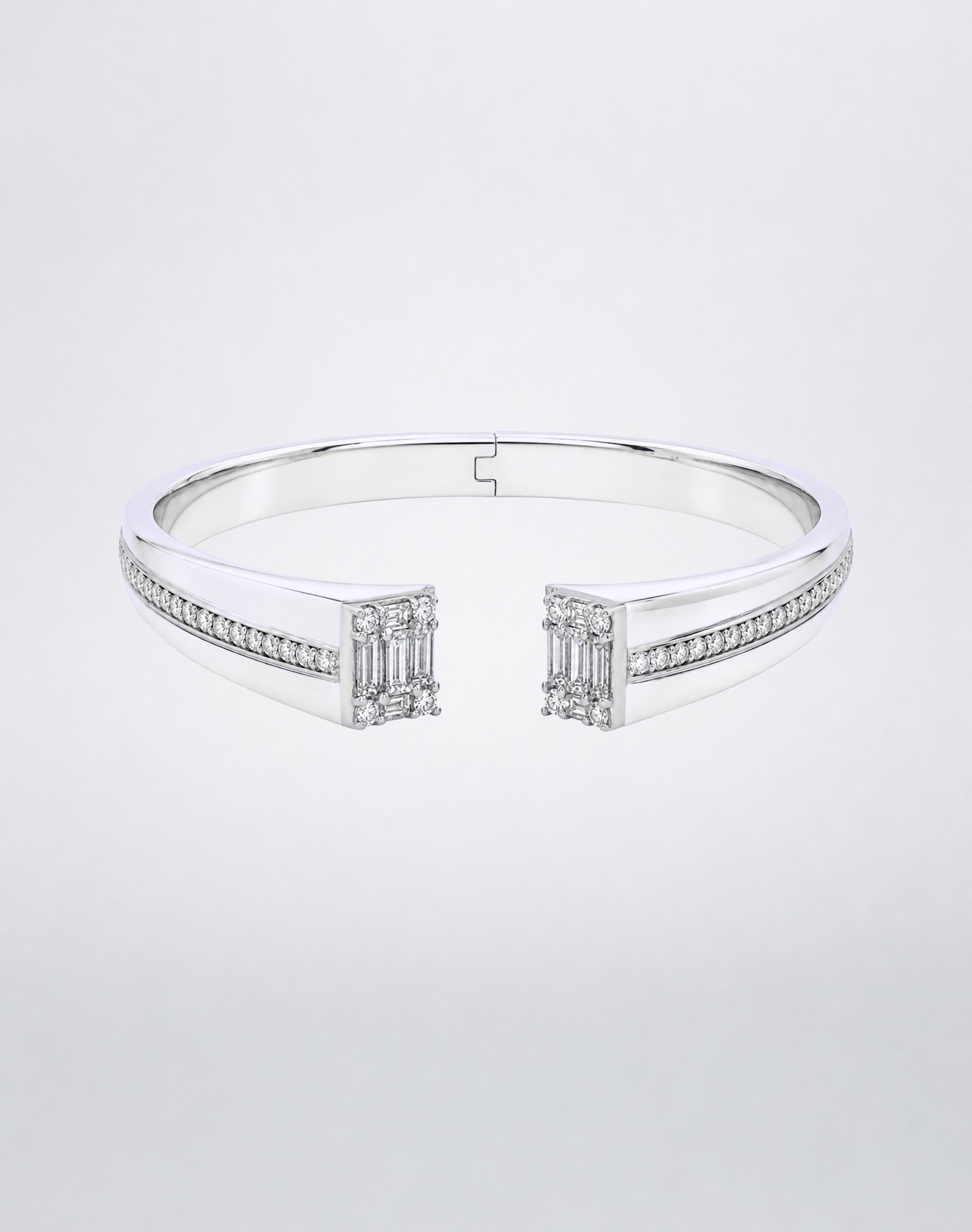 Mindi Mond New York Clarity³ Axis Bangle in 18k white gold, hinged open cuff with a channel of round brilliant diamonds ending in a nine-stone Clarity³ formation on each side, front view