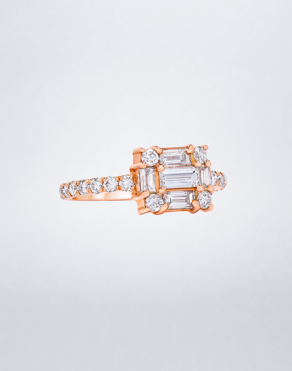 CLARITY³ Cube Diamond Band in 18K rose gold featuring a baguette-cut diamond cluster with round diamonds along the band, by Mindi Mond New York, side view