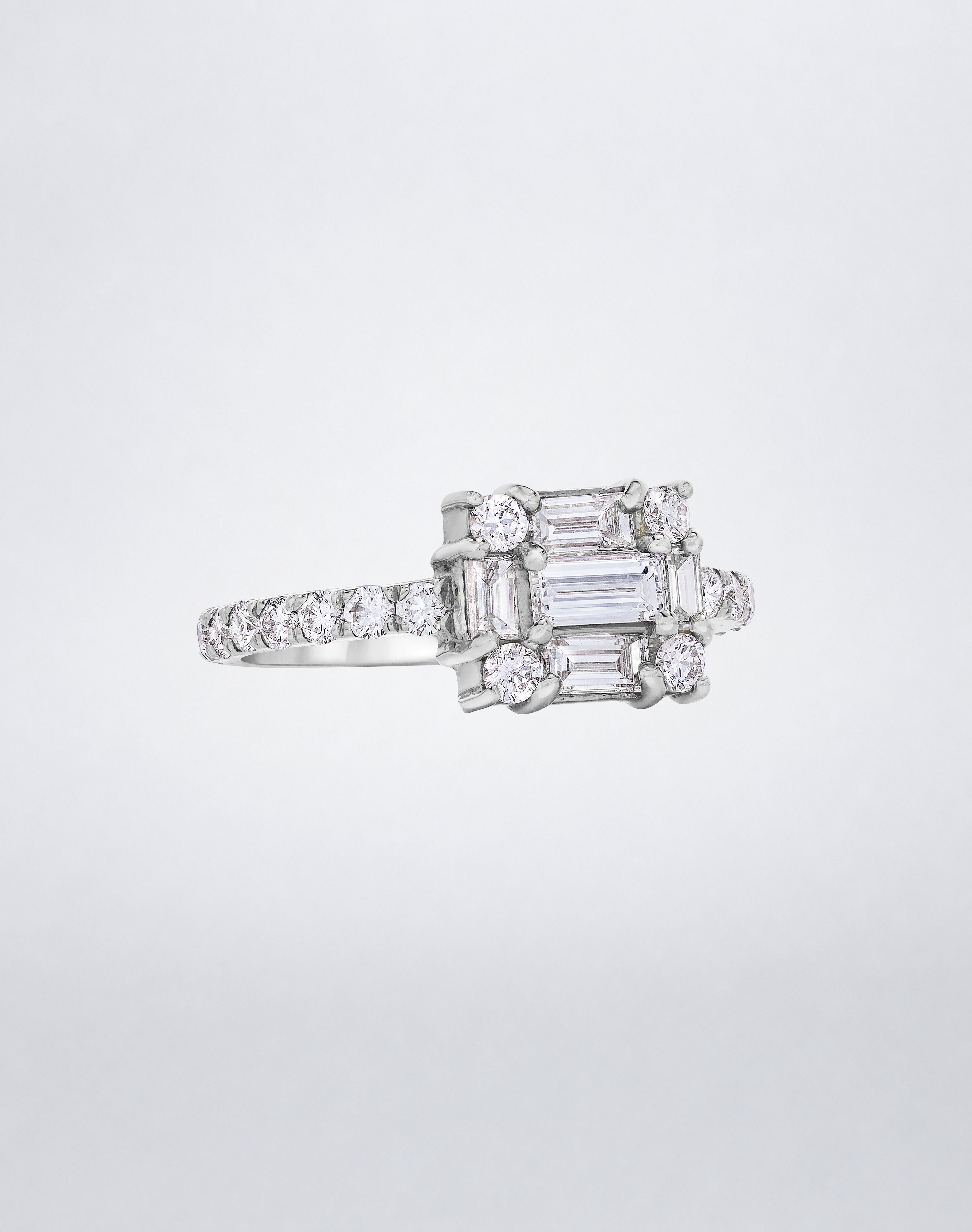 CLARITY³ Cube Diamond Band in 18K white gold featuring a baguette-cut diamond cluster with round diamonds along the band, by Mindi Mond New York, side view
