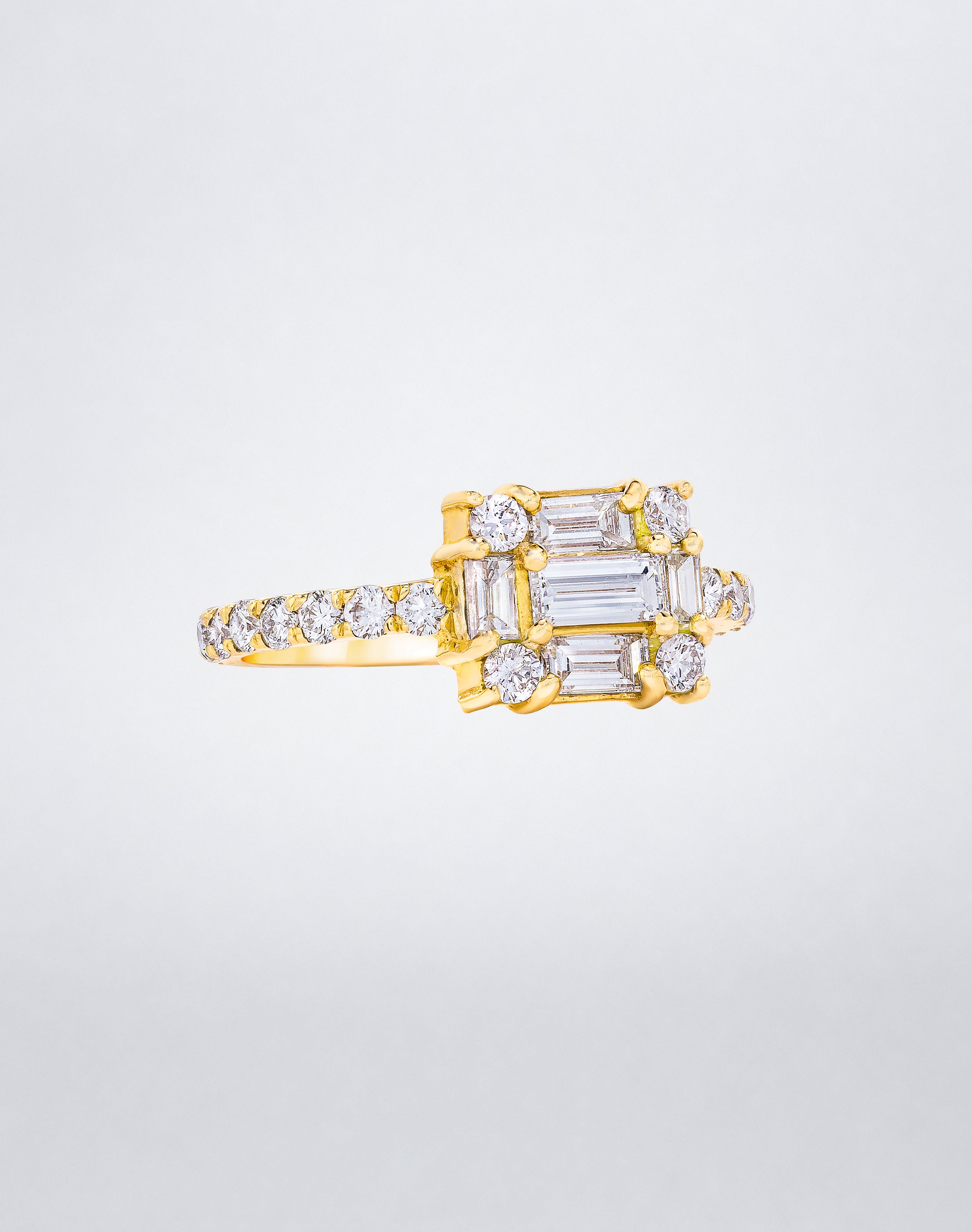 CLARITY³ Cube Diamond Band in 18K yellow gold featuring a baguette-cut diamond cluster with round diamonds along the band, by Mindi Mond New York, side view