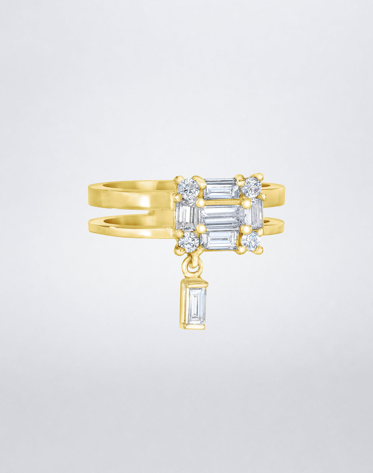 CLARITY³ Dangling Double Shank Ring in 18K yellow gold, featuring a square cluster of baguette and round diamonds with a dangling baguette diamond below, by Mindi Mond New York, side view. 