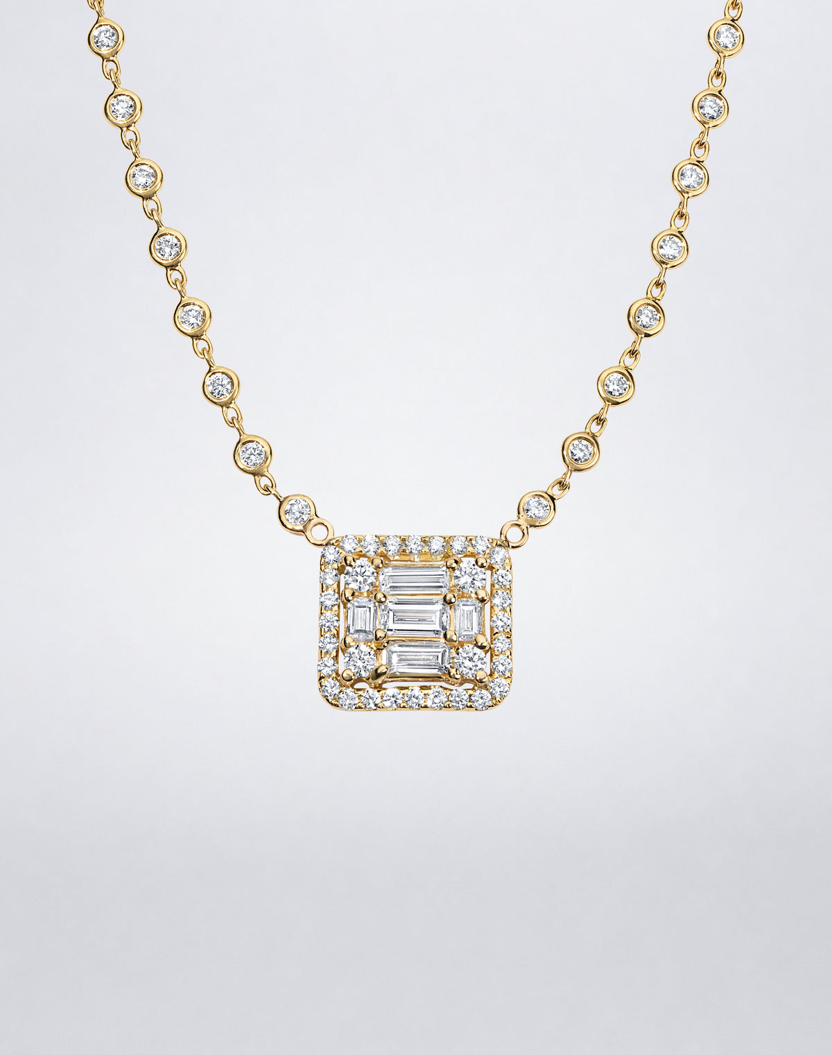 Mindi Mond New York Clarity³ All Diamond Halo Cube Necklace in 18K yellow gold, close-up of the nine-stone diamond cube with pavé halo and bezel-set diamond chain