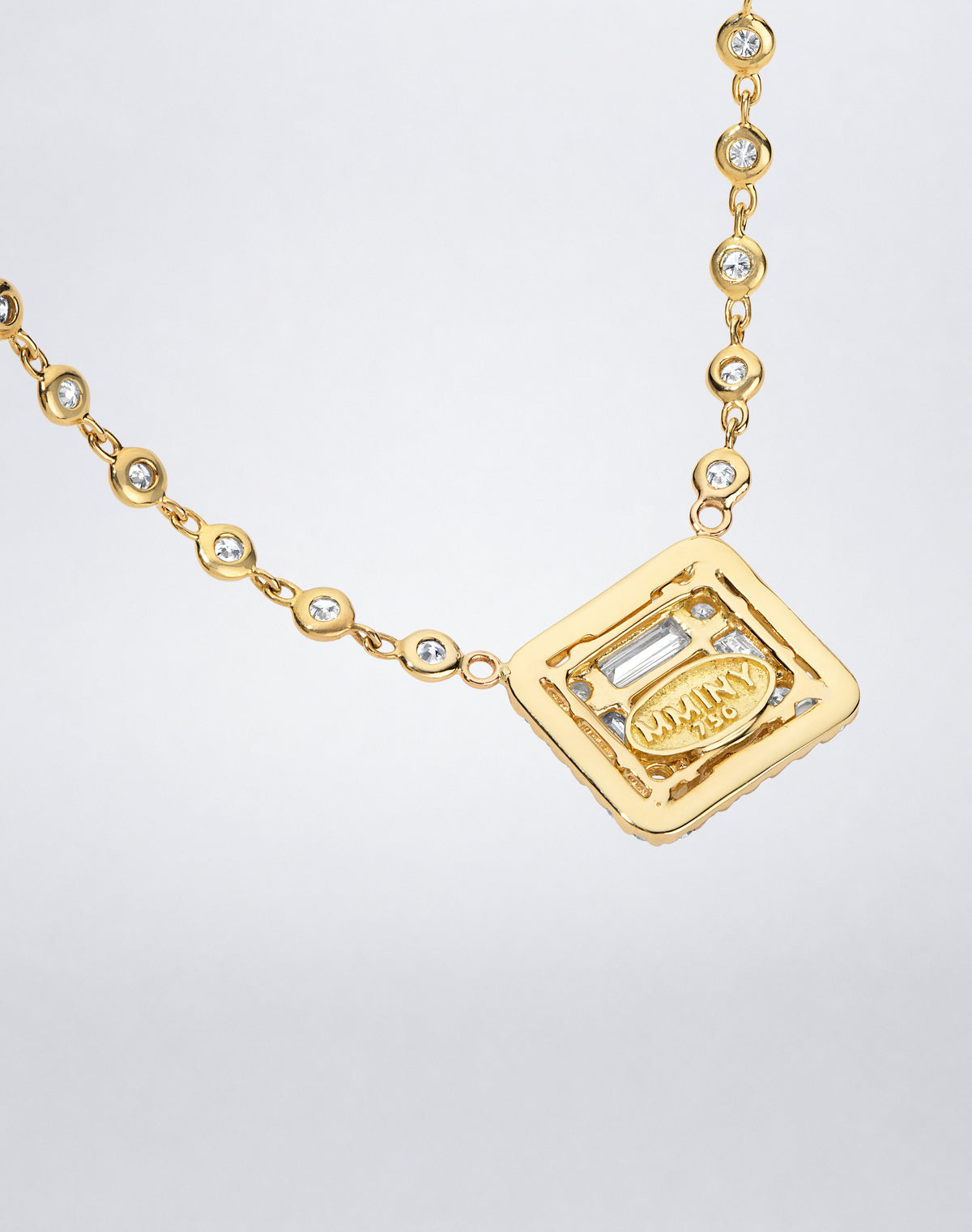 Mindi Mond New York Clarity³ All Diamond Halo Cube Necklace in 18K yellow gold, back of the halo cube showing the open setting and MMINY 750 hallmark