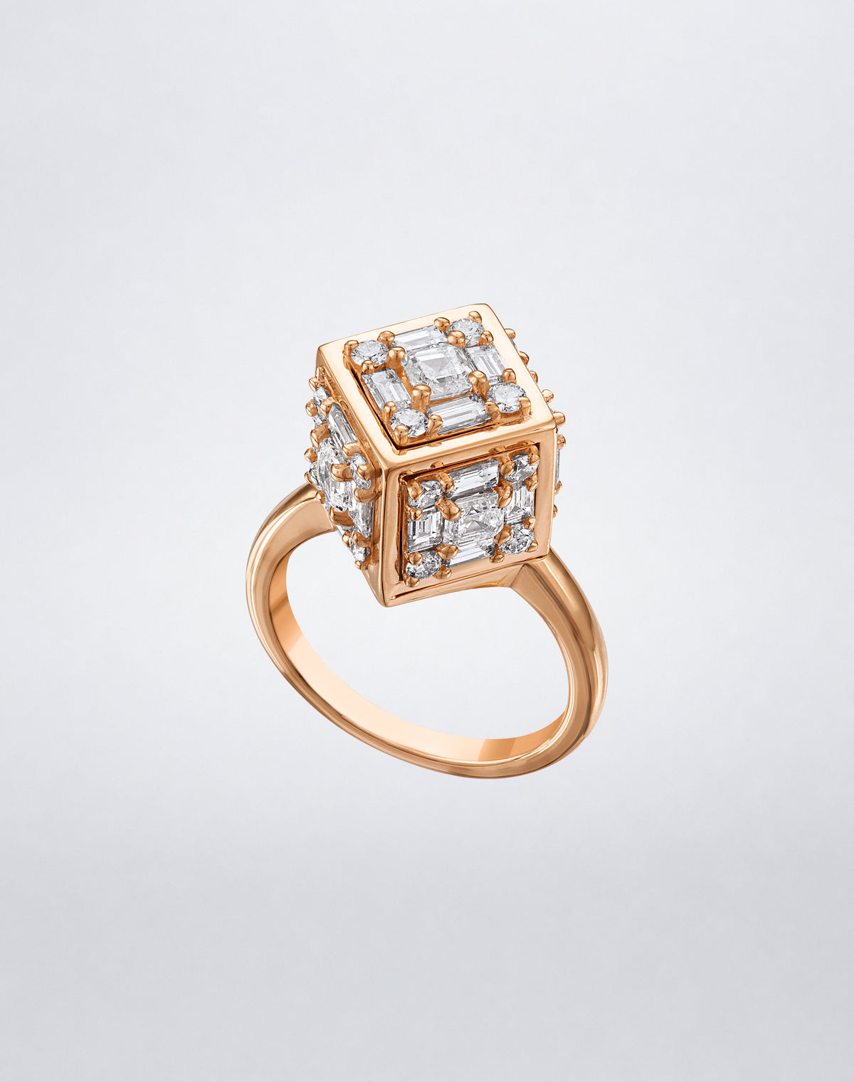CLARITY³ Dimensional Gold Ring in 18K rose gold, featuring a sculptural cube set with baguette and round diamonds, shown at an angle, by Mindi Mond New York