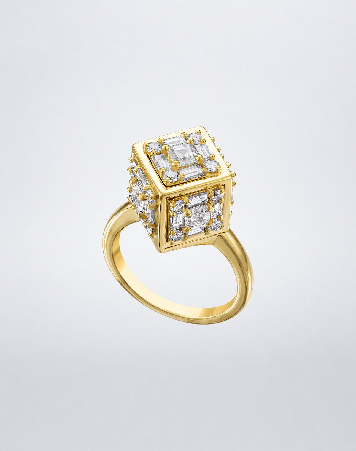 CLARITY³ Dimensional Gold Ring in 18K yellow gold, featuring a sculptural cube set with baguette and round diamonds, shown at an angle, by Mindi Mond New York