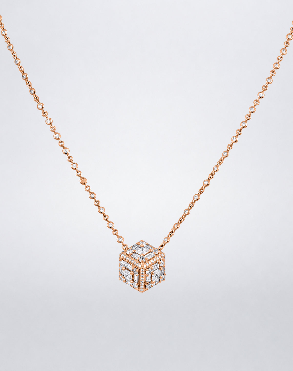 Mindi Mond New York Clarity³ Dimensional Halo Cube Necklace in 18K rose gold, three-dimensional diamond cube with a nine-stone formation on each face and pavé edges, on a bezel-set diamond chain