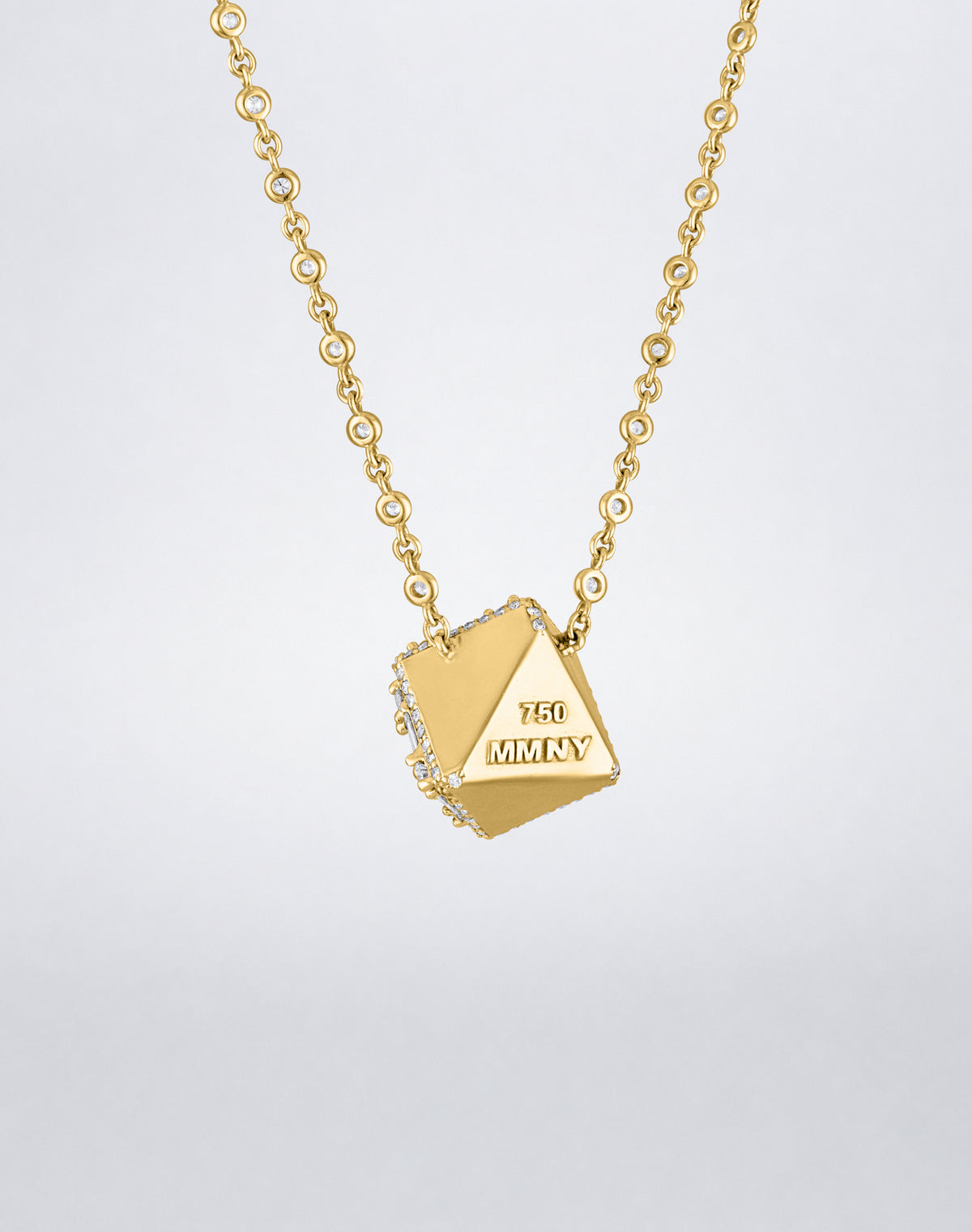 Mindi Mond New York Clarity³ Dimensional Halo Cube Necklace in 18K yellow gold, back of the cube showing polished gold faces and MMNY 750 hallmark