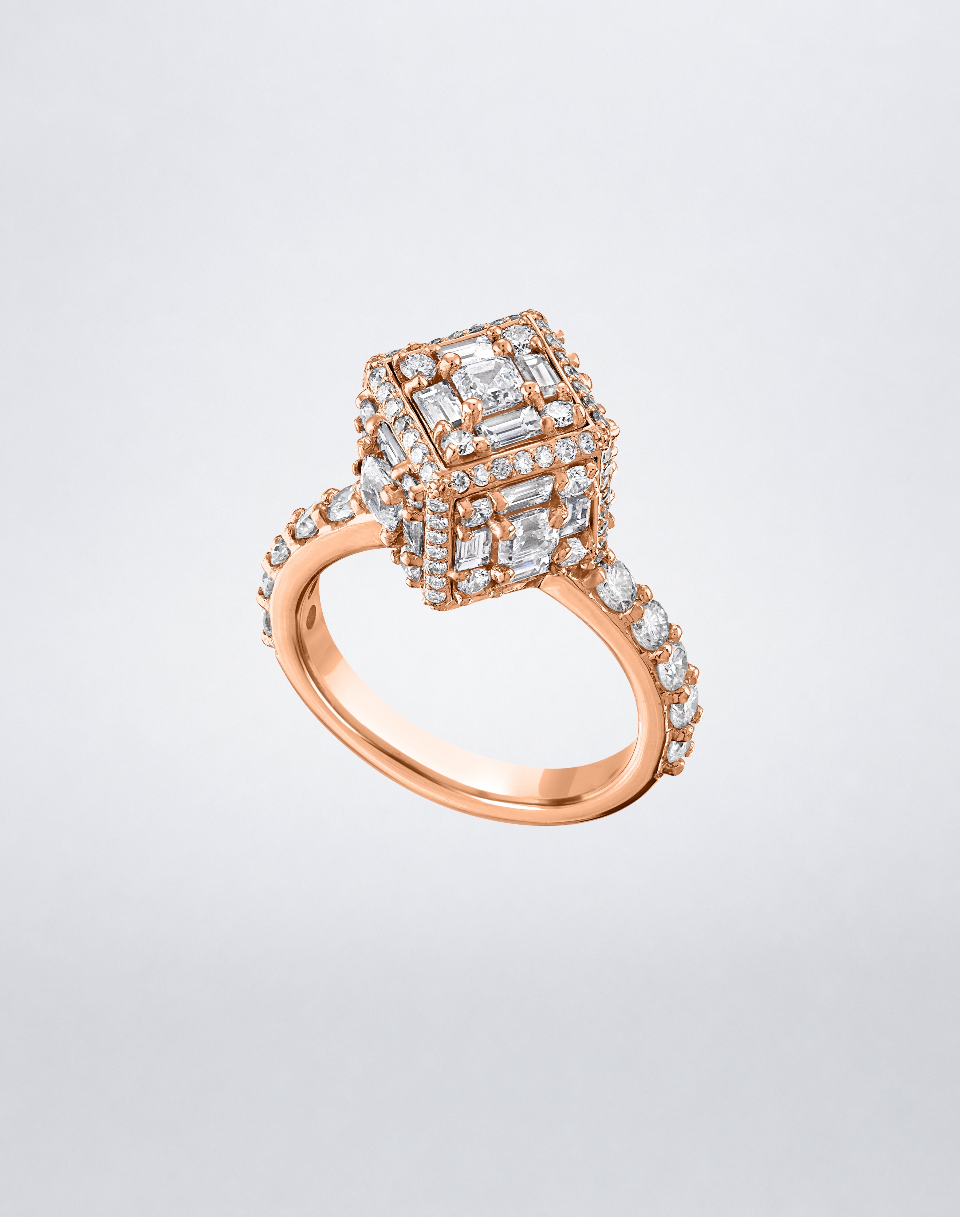CLARITY³ Dimensional Halo Diamond Ring in 18K rose gold, featuring a sculptural diamond cube on a pavé diamond shank, shown at an angle, by Mindi Mond New York
