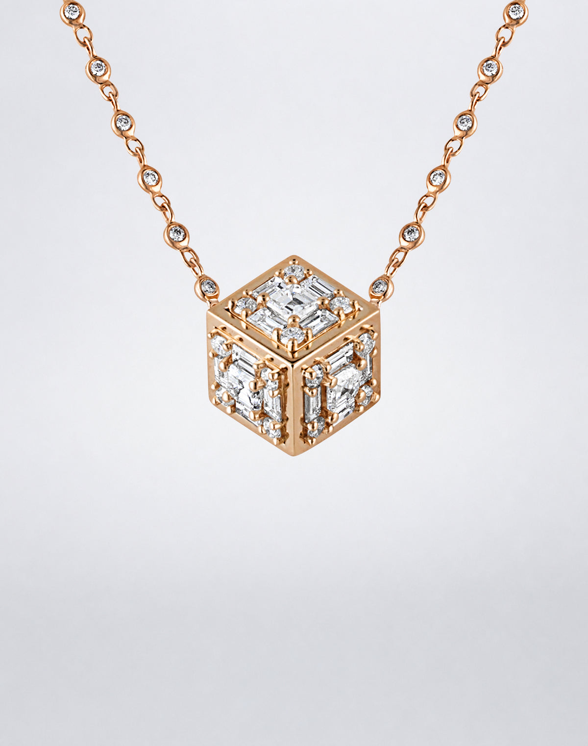 Mindi Mond New York Clarity³ Dimensional Gold Pendant Necklace in 18K rose gold, close-up of the diamond cube showing three faces with polished gold edges