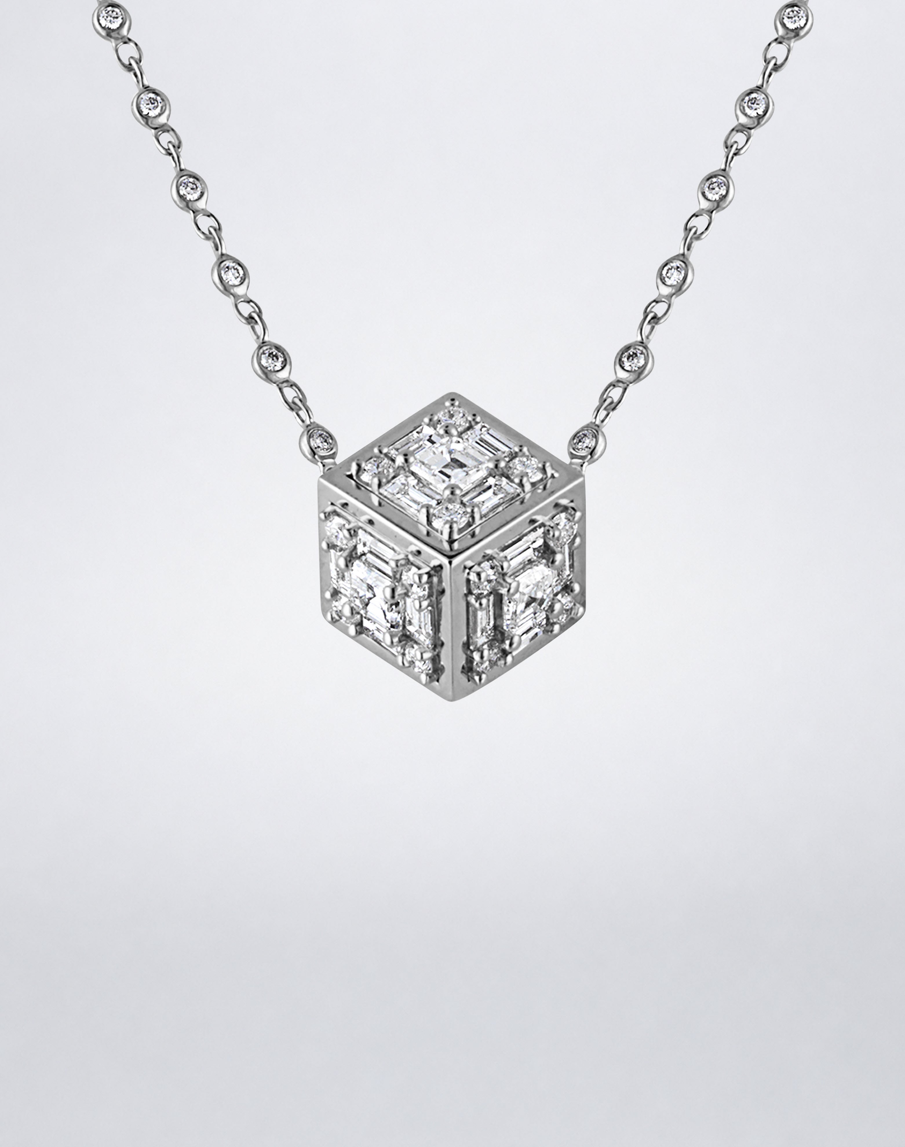 Mindi Mond New York Clarity³ Dimensional Gold Pendant Necklace in 18K white gold, close-up of the diamond cube showing three faces with polished gold edges