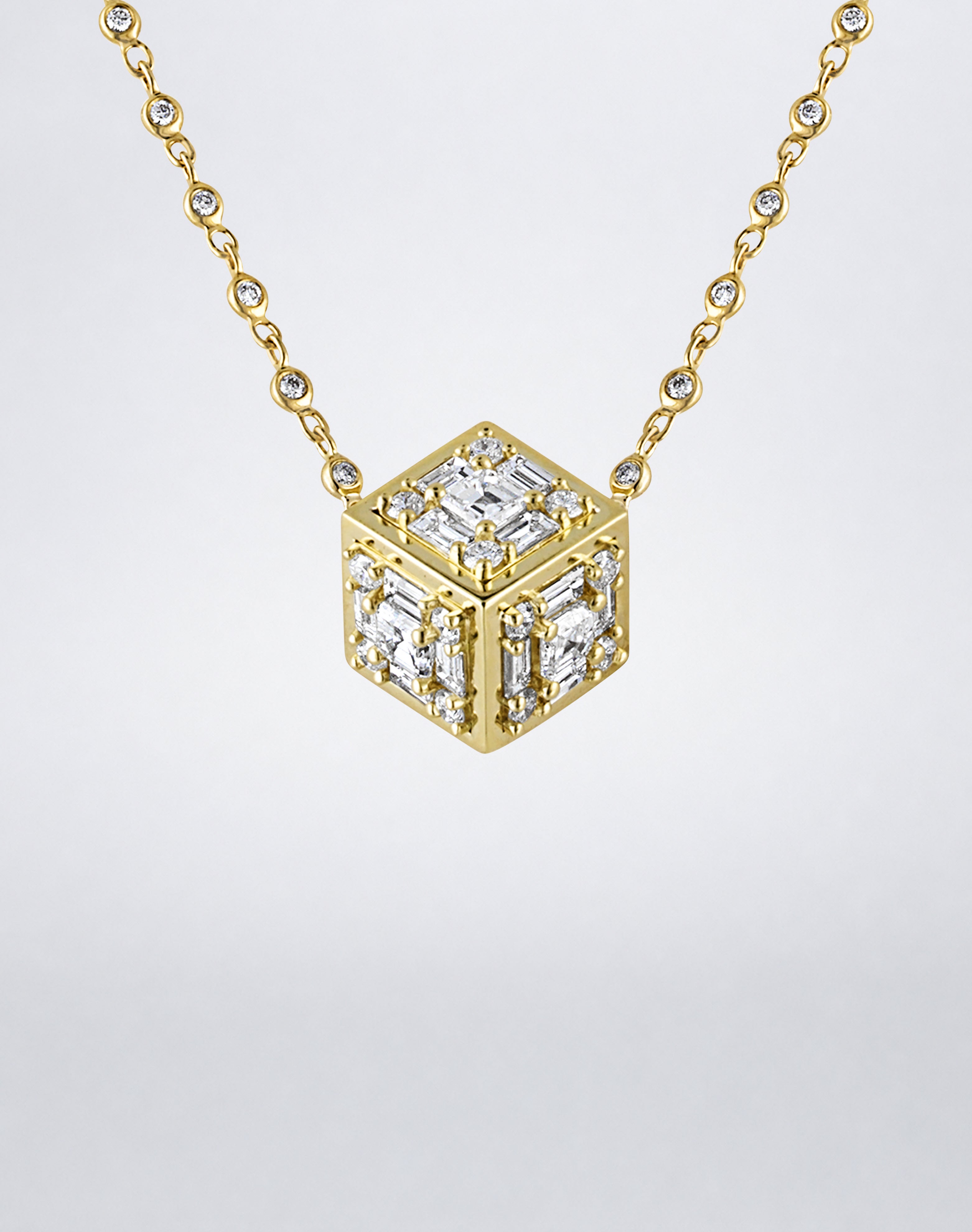 Mindi Mond New York Clarity³ Dimensional Gold Pendant Necklace in 18K yellow gold, close-up of the diamond cube showing three faces with polished gold edges
