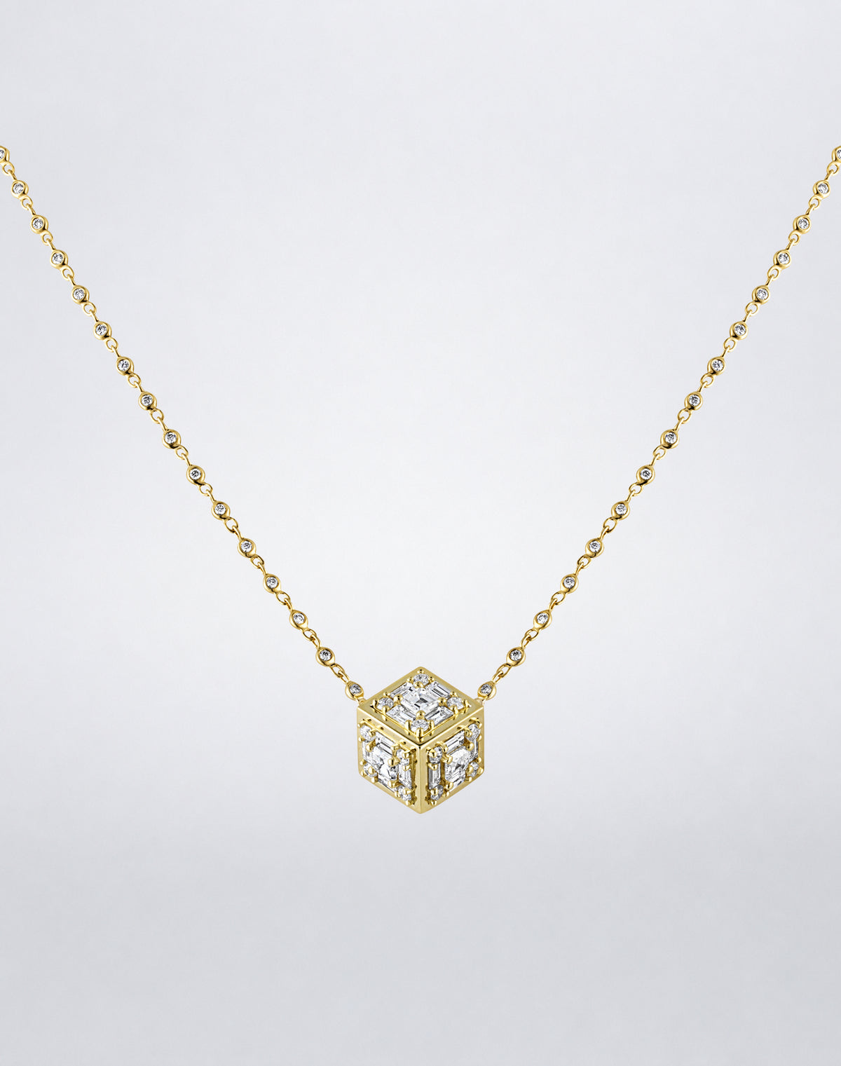 Mindi Mond New York Clarity³ Dimensional Gold Pendant Necklace in 18K yellow gold, three-dimensional diamond cube with a nine-stone formation on each face and polished gold edges, on a bezel-set diamond chain, full view
