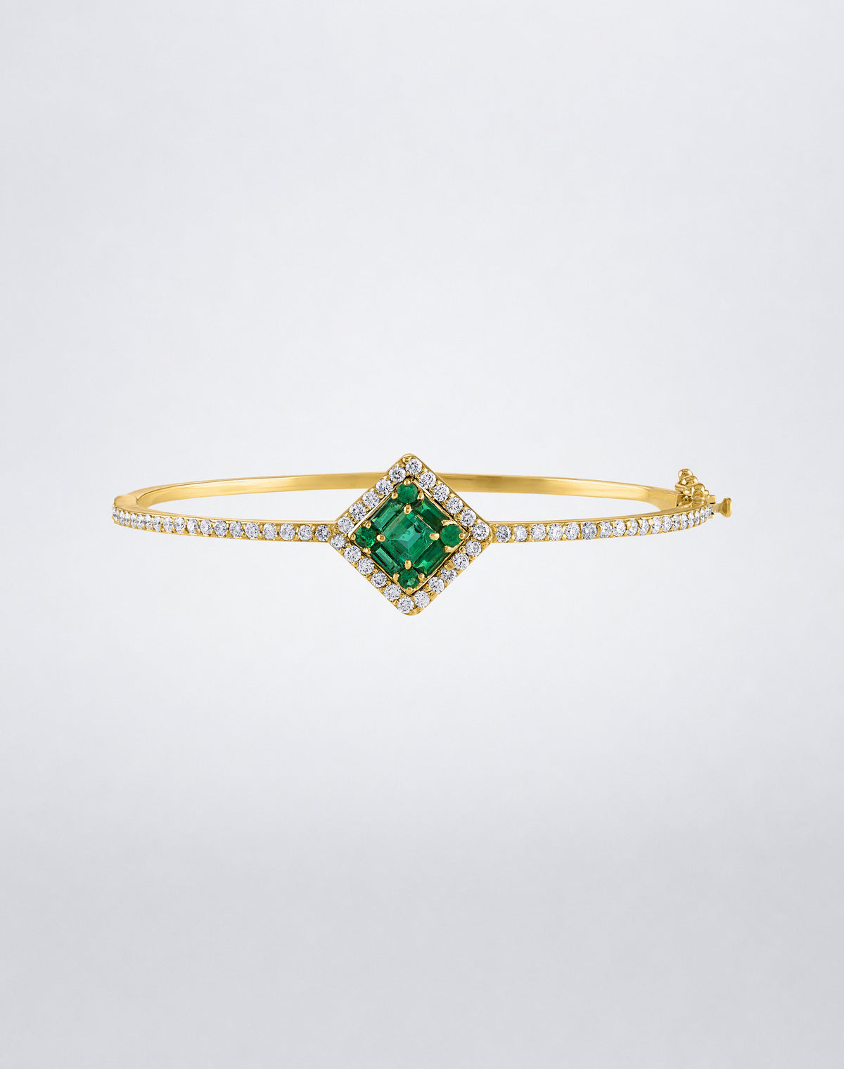 Mindi Mond New York Clarity³ Gemstone Halo Bracelet in 18k yellow gold with a nine-stone baguette and round emerald center, diamond halo and pavé band, front view
