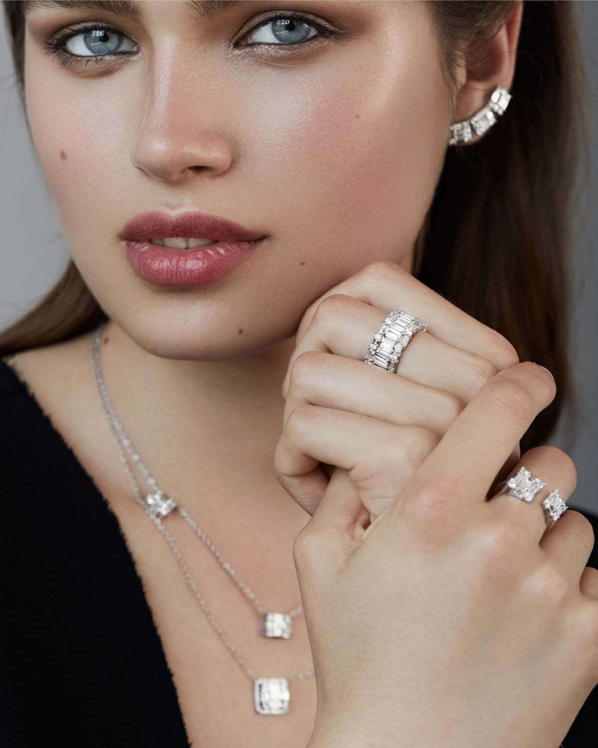 Model wearing the CLARITY³ Eternity Band in platinum with baguette-cut and round diamonds