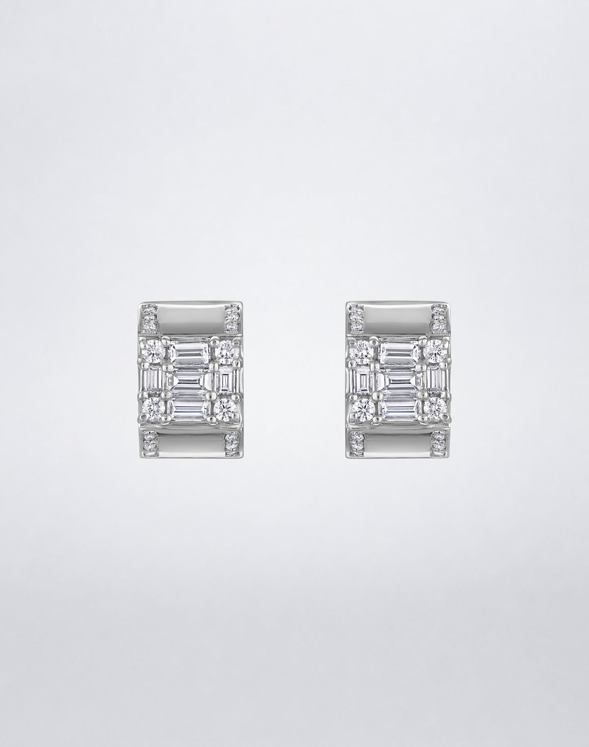 Mindi Mond New York Clarity³ Lovers Huggie Earrings in 18K white gold, a nine-stone diamond formation on a wide polished huggie with pavé edges