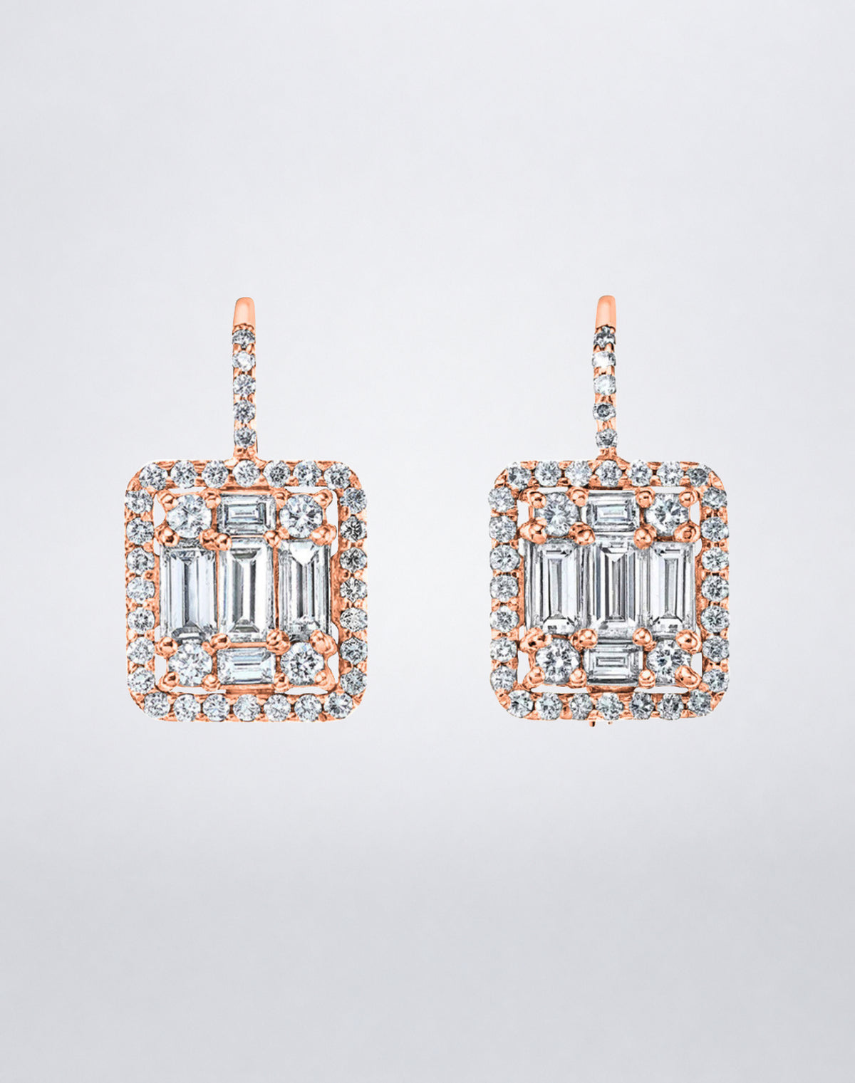 Mindi Mond New York Clarity³ Mega Halo Earrings in 18K rose gold, an enlarged nine-stone diamond formation framed in a diamond halo on a pavé lever-back