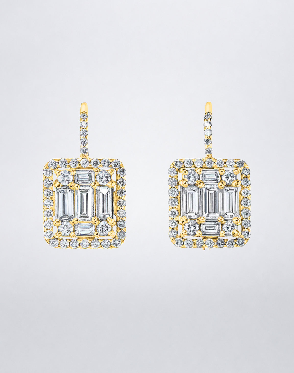 Mindi Mond New York Clarity³ Mega Halo Earrings in 18K yellow gold, an enlarged nine-stone diamond formation framed in a diamond halo on a pavé lever-back