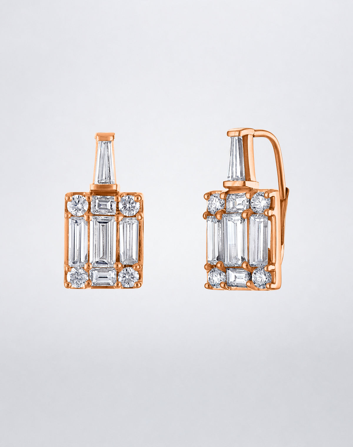 Mindi Mond New York Clarity³ Mega Tapered Baguette Earrings in 18K rose gold, side view of a tapered baguette diamond above an enlarged nine-stone formation on a lever-back