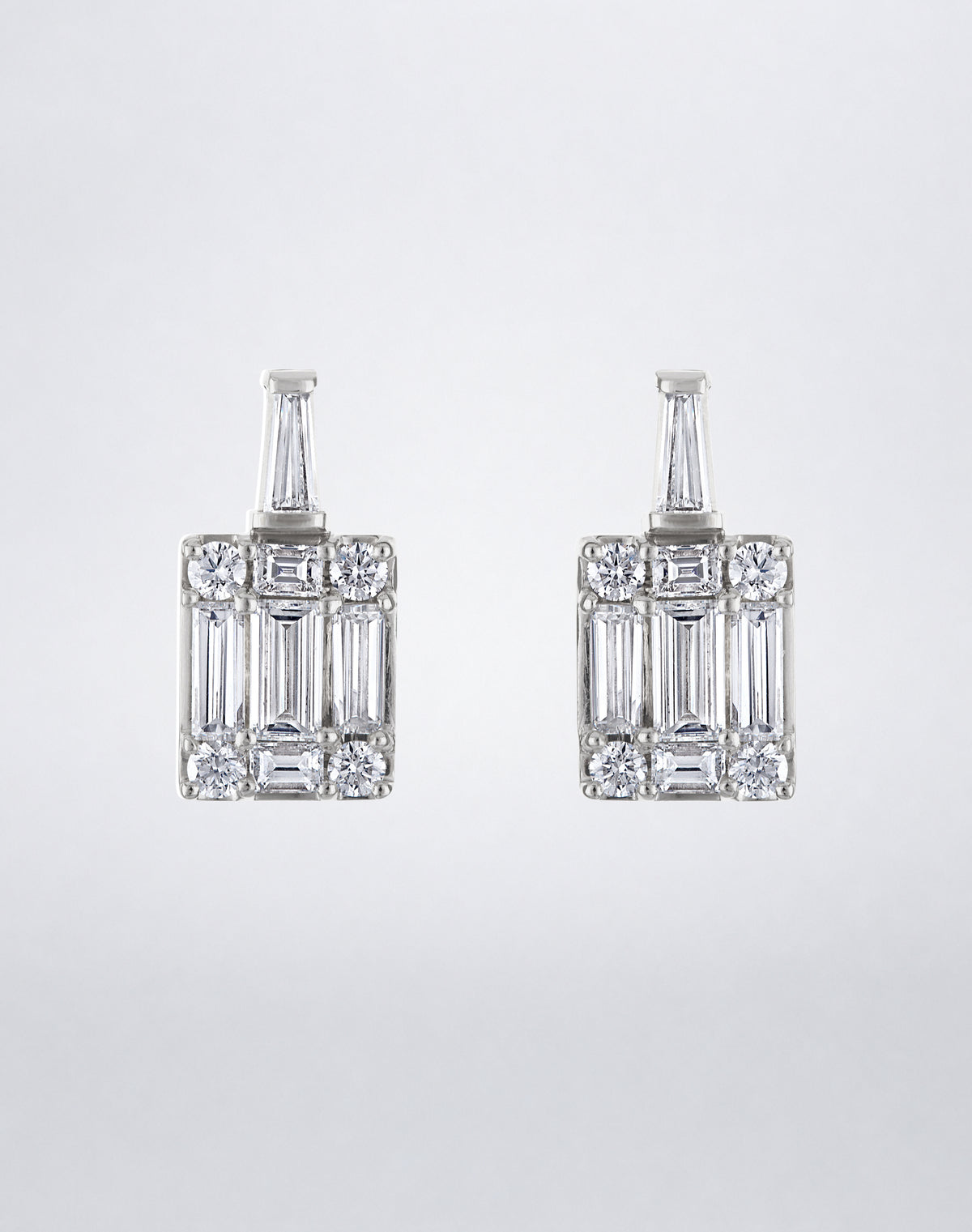 Mindi Mond New York Clarity³ Mega Tapered Baguette Earrings in 18K white gold, a tapered baguette diamond set above an enlarged nine-stone diamond formation