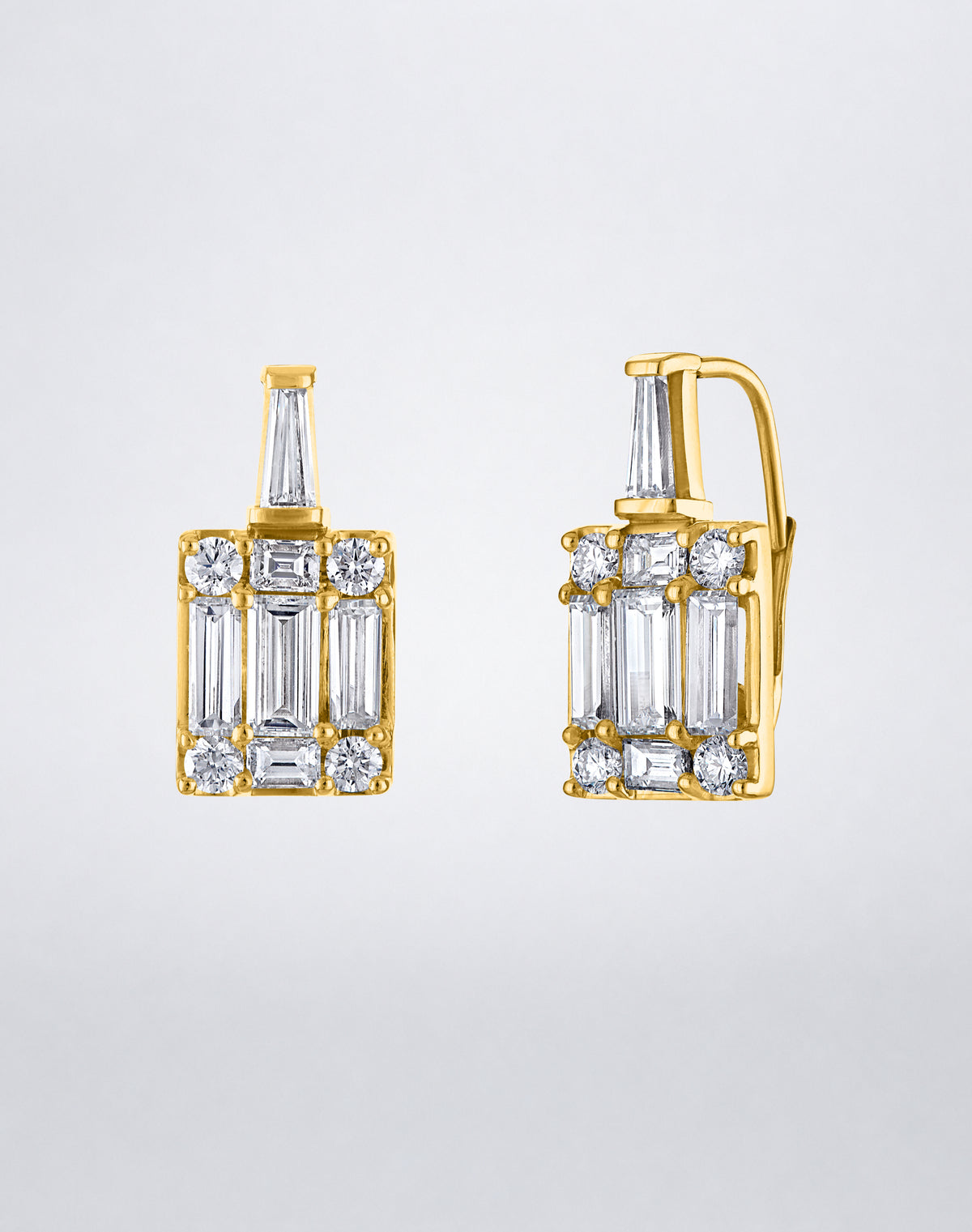 Mindi Mond New York Clarity³ Mega Tapered Baguette Earrings in 18K yellow gold, side view of a tapered baguette diamond above an enlarged nine-stone formation on a lever-back